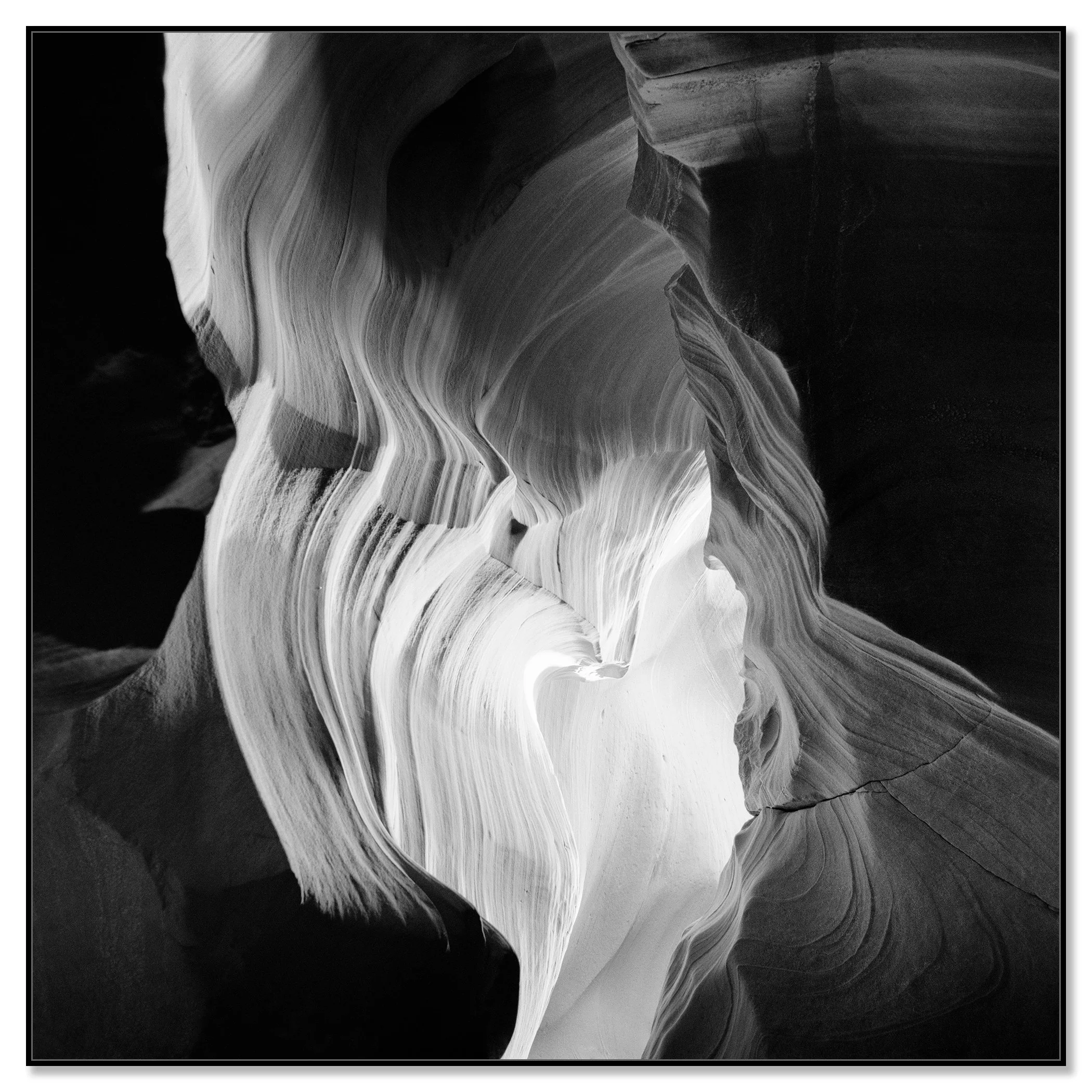 Black-and-white close-up of flowing sandstone curves and layered textures in Antelope Canyon – framed ArtBox black