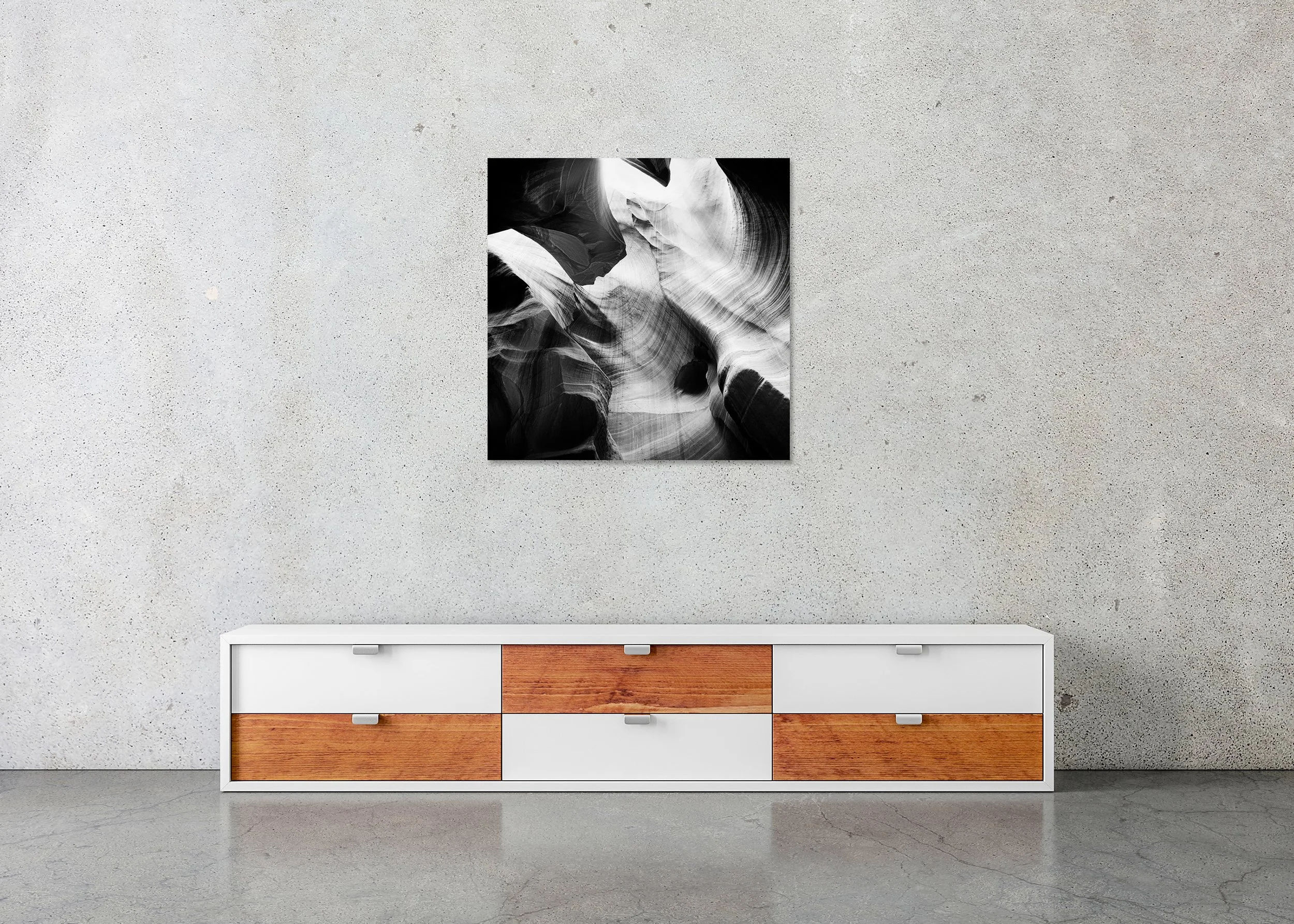 Antelope Canyon Study 8 displayed in a modern interior as a frameless black-and-white artwork mounted on aluminium Dibond by Gerald Berghammer.