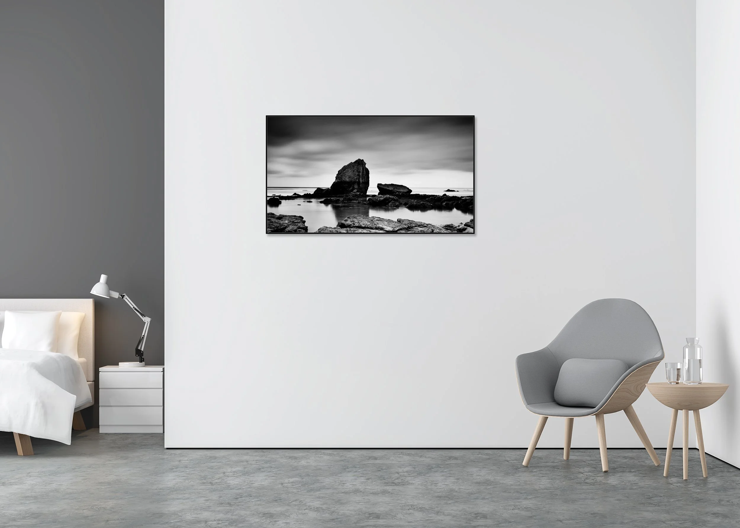 Monochrome coastal landscape print with dramatic sea stack, rocky shoreline and still water at low tide, mounted to Dibond in an aluminium ArtBox