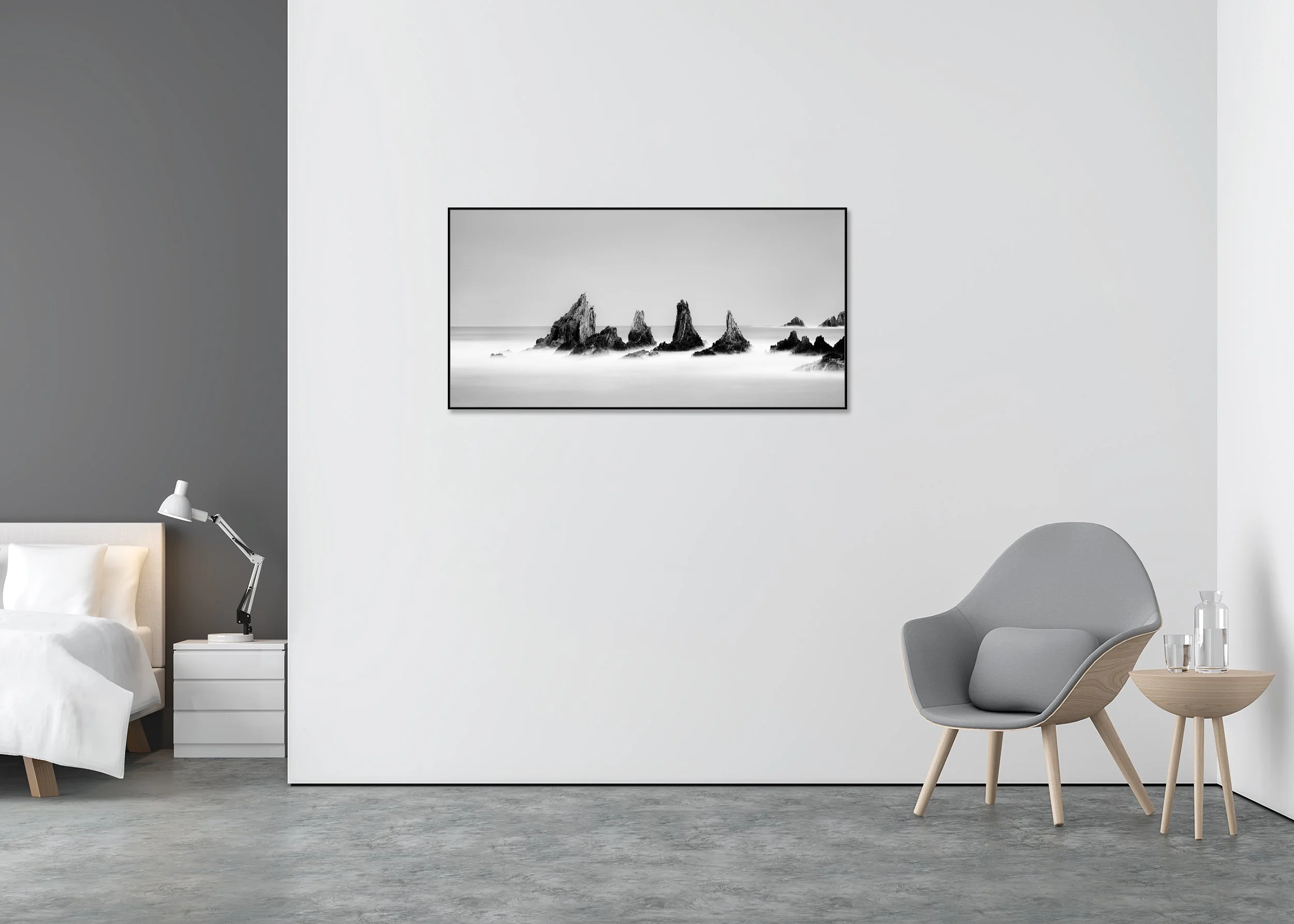 Long-exposure black-and-white ocean scene with jagged rocks, smooth misty water and clear sky, printed as a ChromaLuxe metal print in an aluminium ArtBox frame.