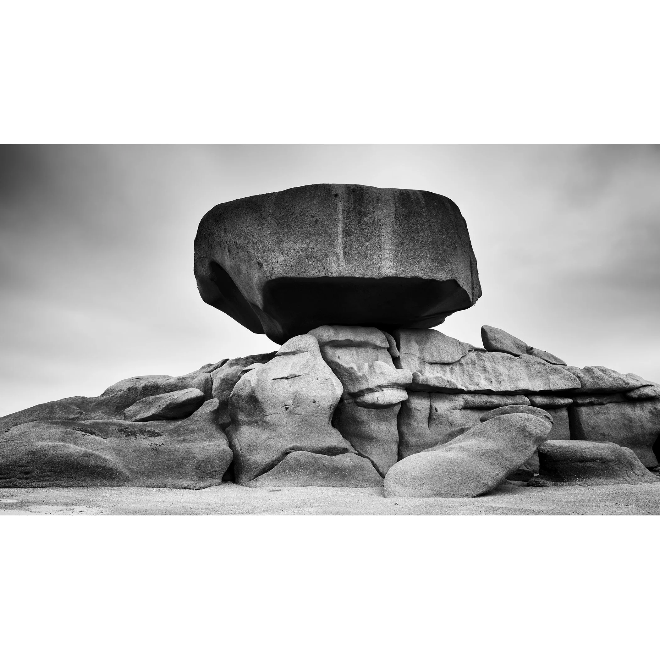 Pink Granite Coast Panorama Study 2 by Gerald Berghammer, minimalist black-and-white photograph of a balanced granite boulder in Brittany, France.