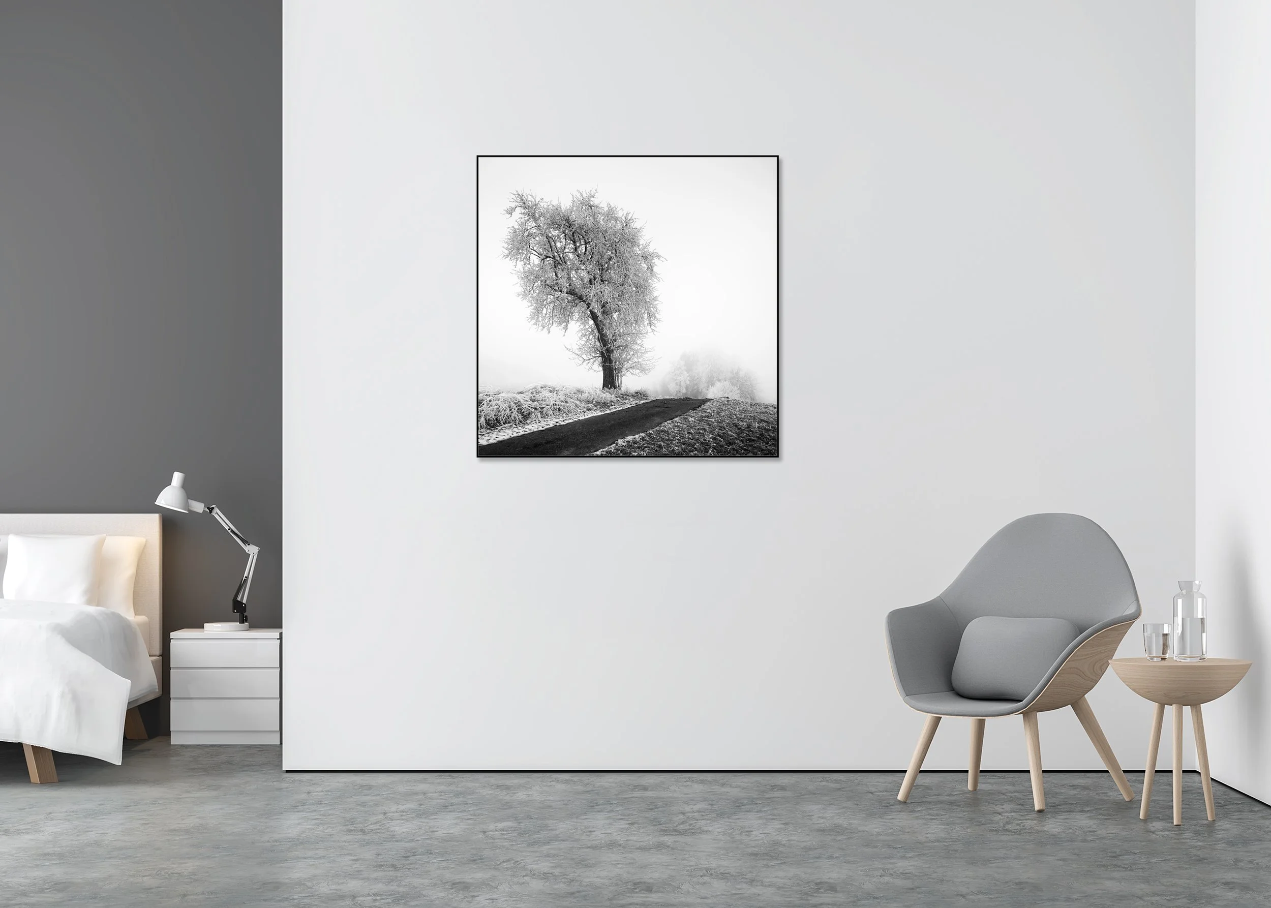 Alt text (SEO-safe):  Minimalist black-and-white winter landscape with a frost-covered tree beside a quiet rural road in soft fog, ChromaLuxe metal print in an aluminium ArtBox.