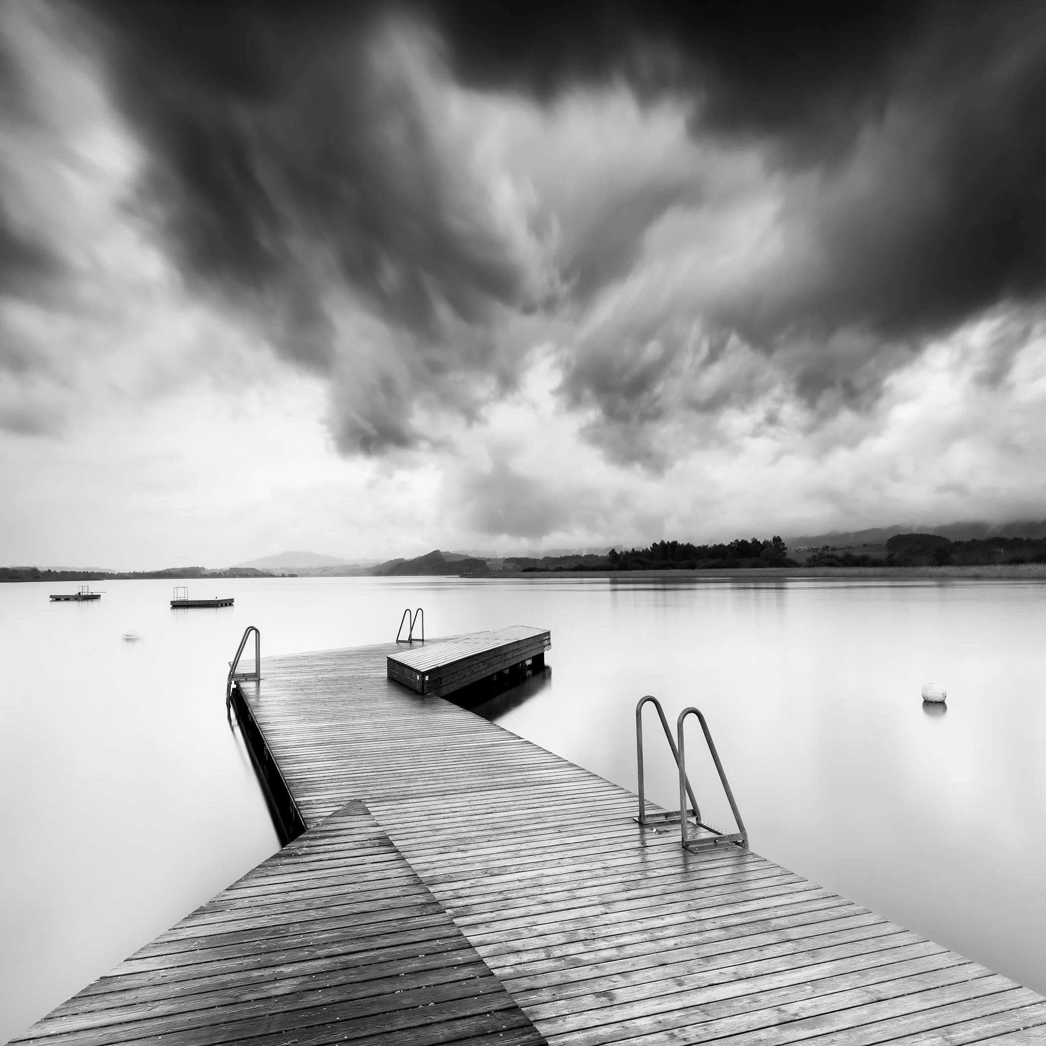 Full view of Wooden Pier in a Storm, Study 1, a black-and-white lakeside photograph by Gerald Berghammer