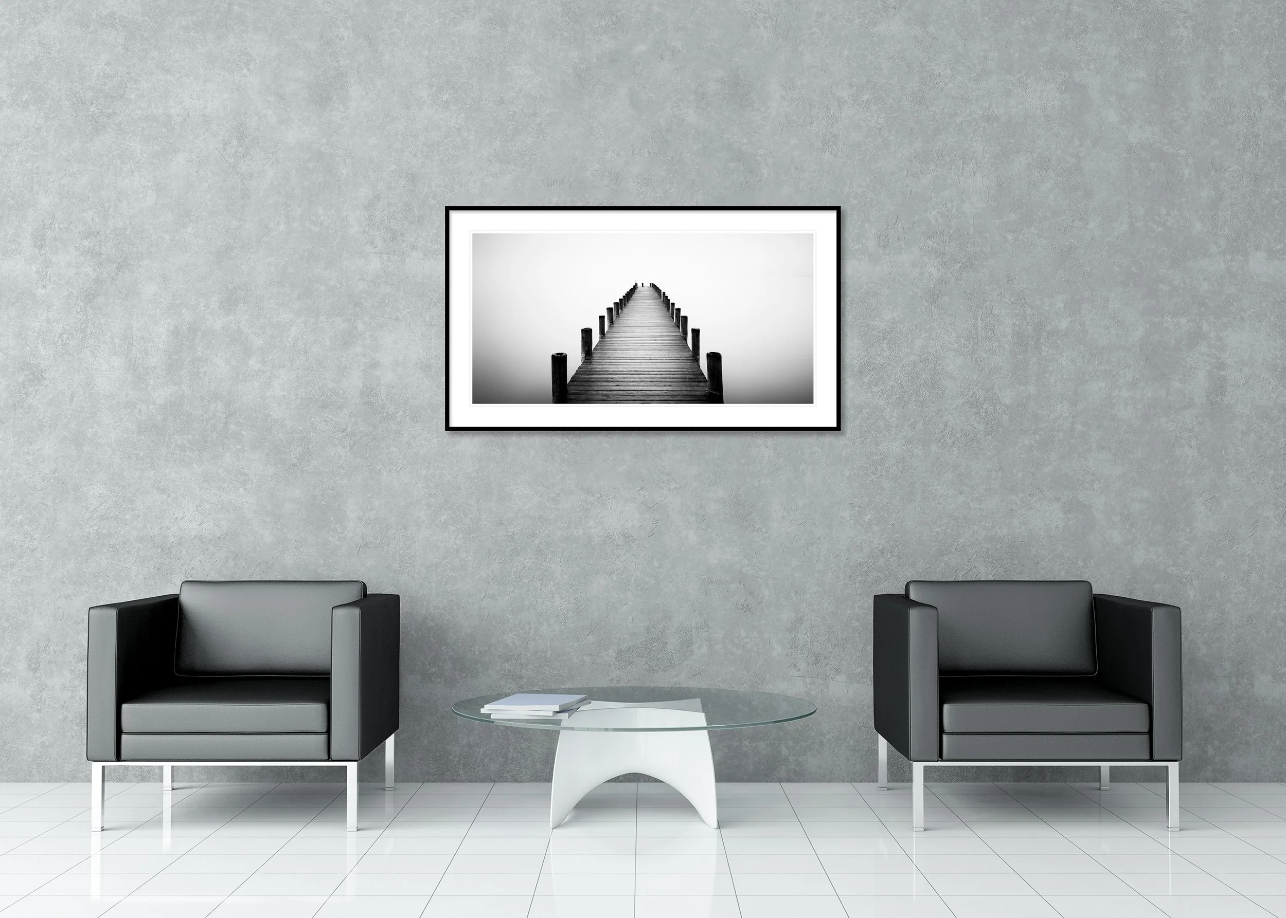 Minimalist black and white archival pigment print of a long wooden jetty in the mist, presented in a classic frame with a mount