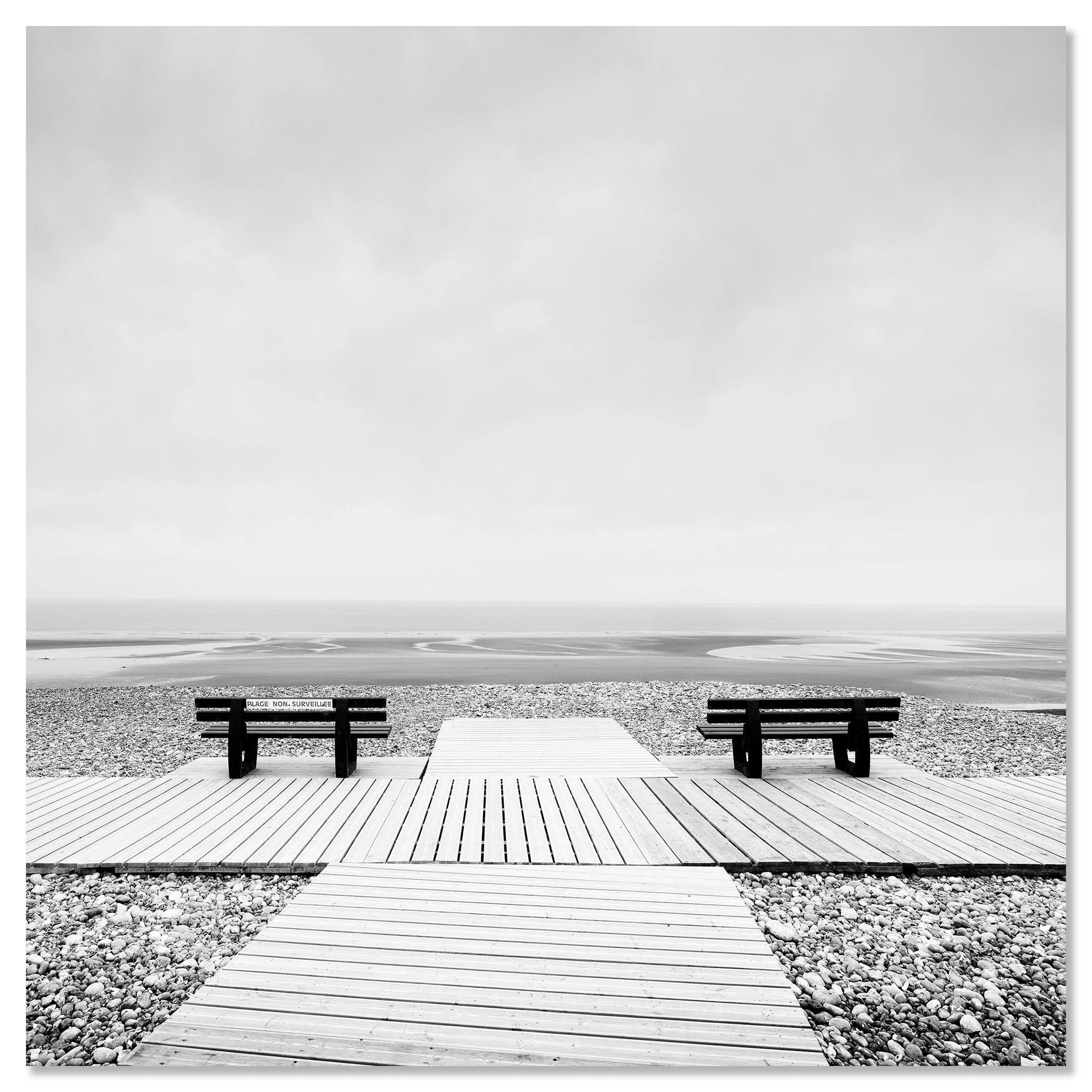 Minimalist beach photograph from France featuring benches, a calm shoreline, open horizon and a clean, modern landscape composition – dibond frameless