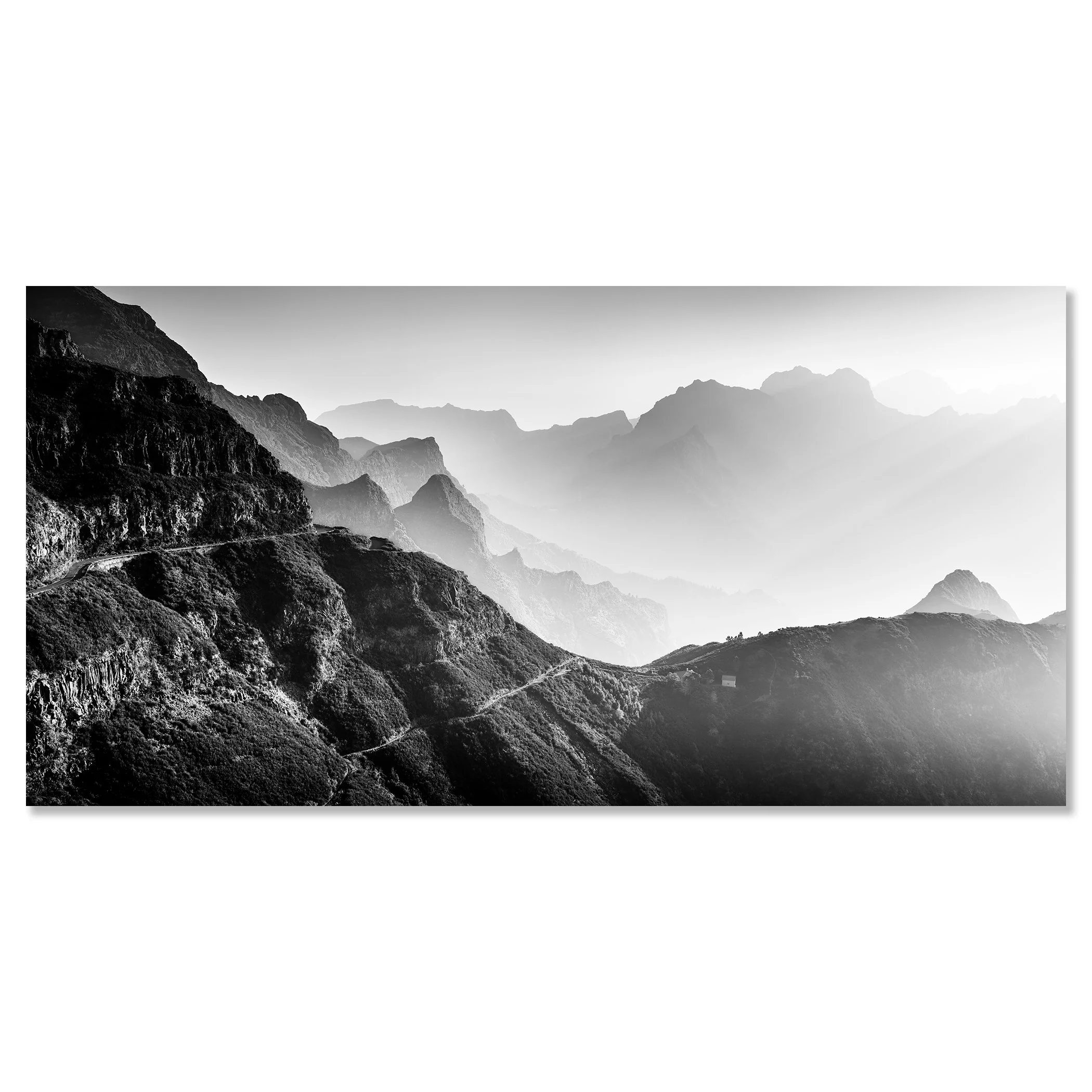 Black-and-white mountain landscape with layered peaks, a winding road and soft atmospheric haze – dipond frameless