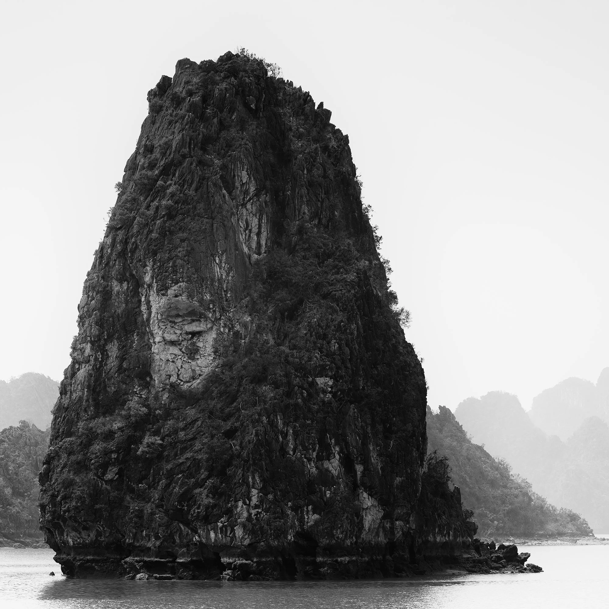 Detail view of Ha Long Bay Panorama, Study 1 showing limestone karsts and misty water in Vietnam by Gerald Berghammer.