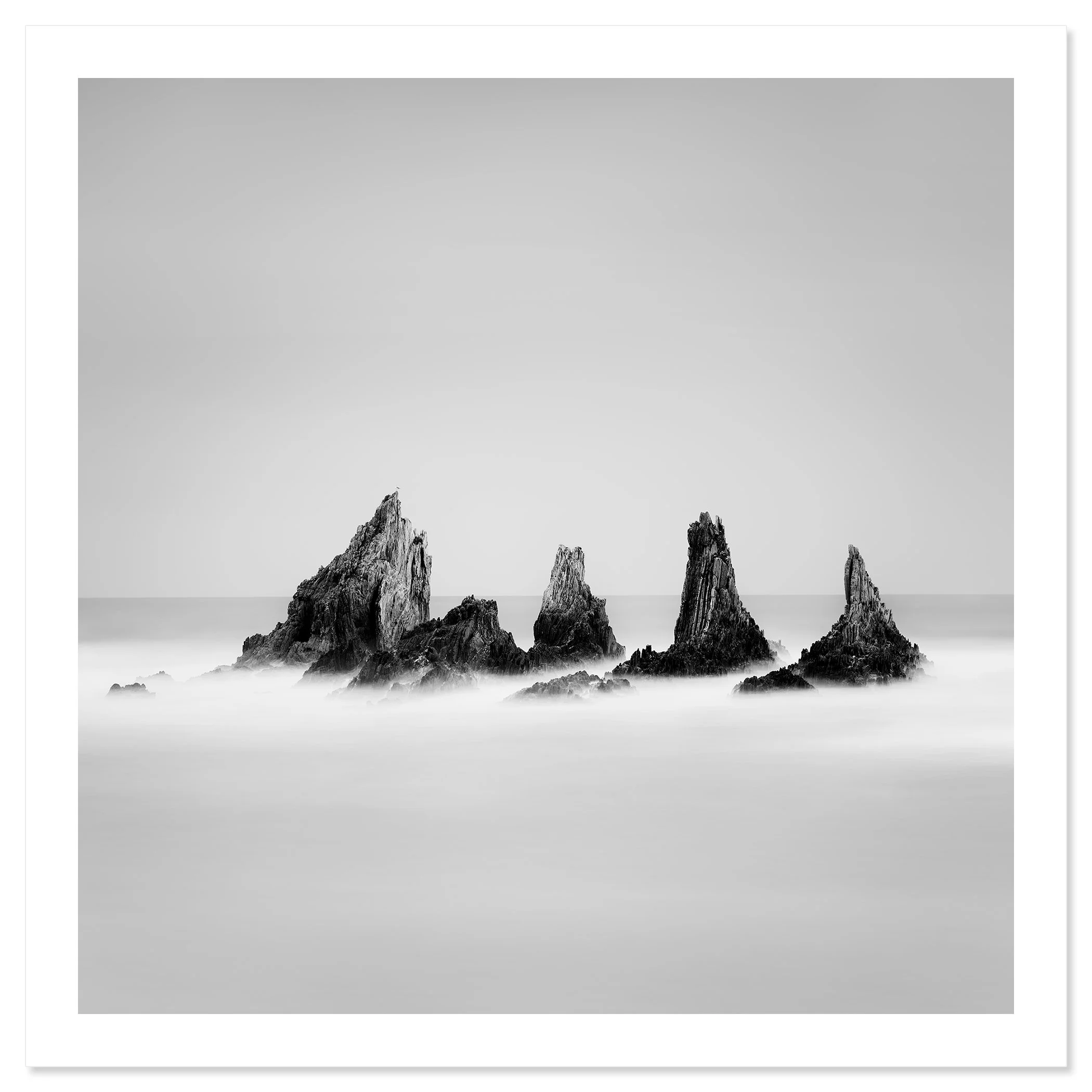 Rocky Peaks Study 1 by Gerald Berghammer, black-and-white fine art seascape of five Atlantic sea stacks in Spain, shown as an archival pigment print.