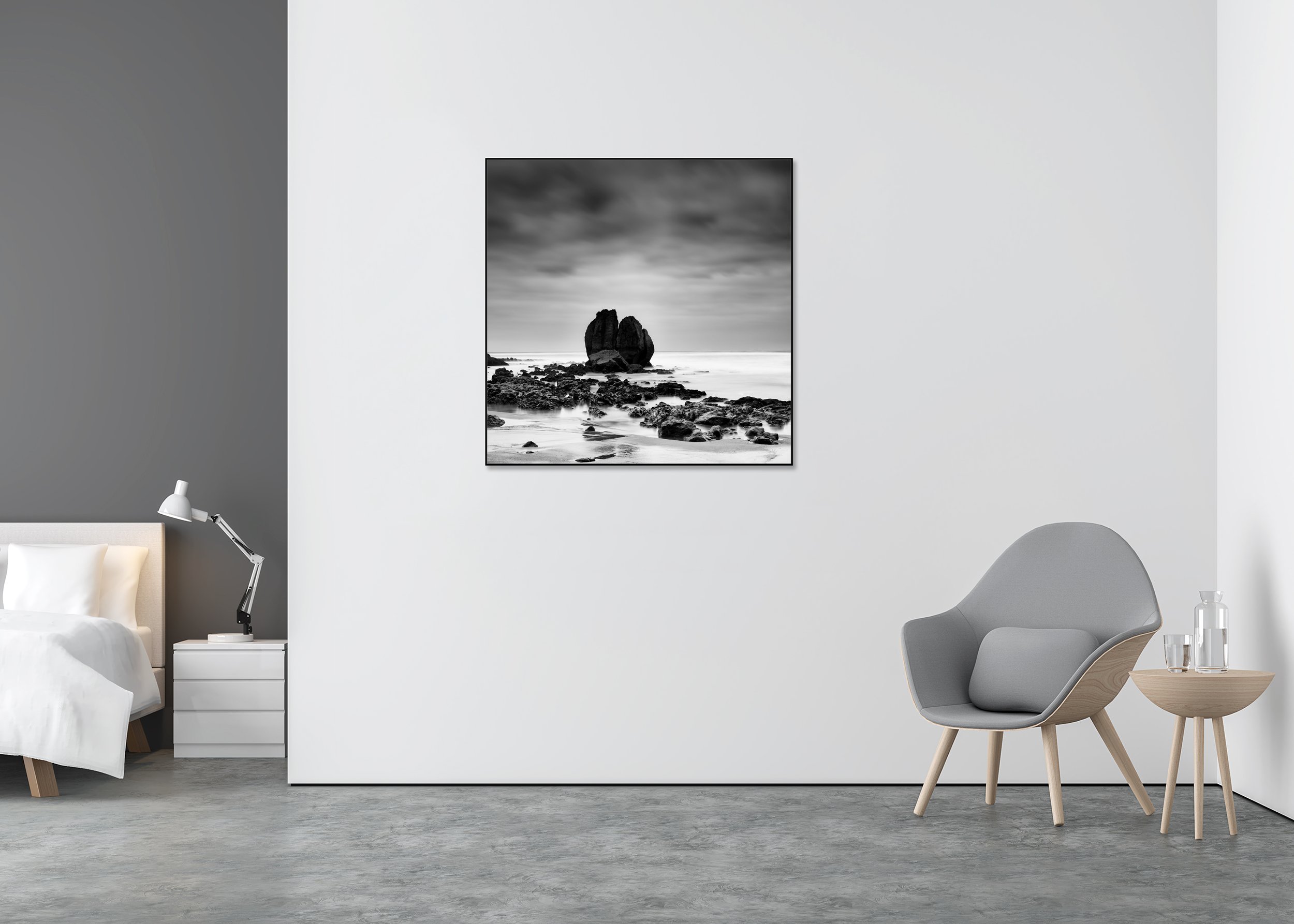 Rocks on the Shore Study 2 displayed in a modern interior as a black-and-white Dibond print in a black aluminium ArtBox frame by Gerald Berghammer.