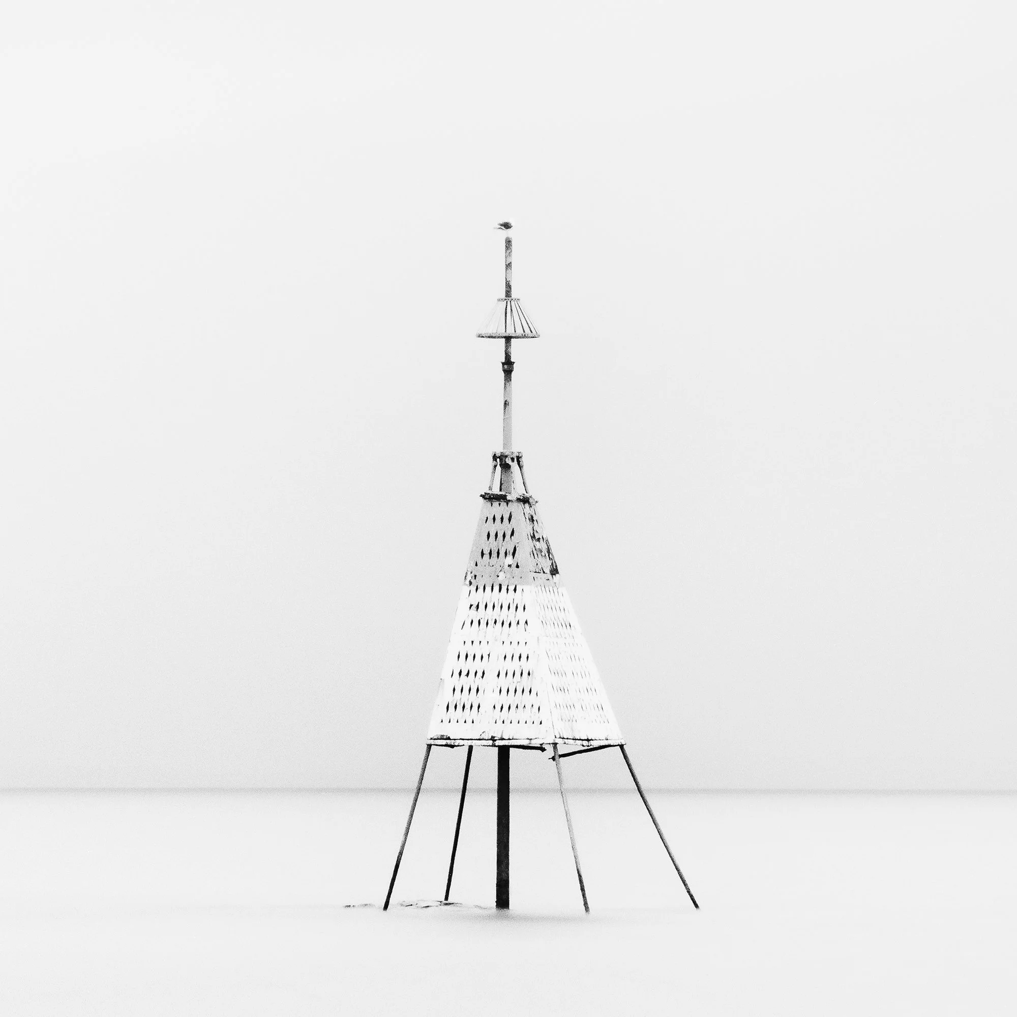 Gerald Berghammer - Black and white long exposure seascape photography. Solitary metal structure lighthouse with a conical top, standing in the Ocean. Print detail 3