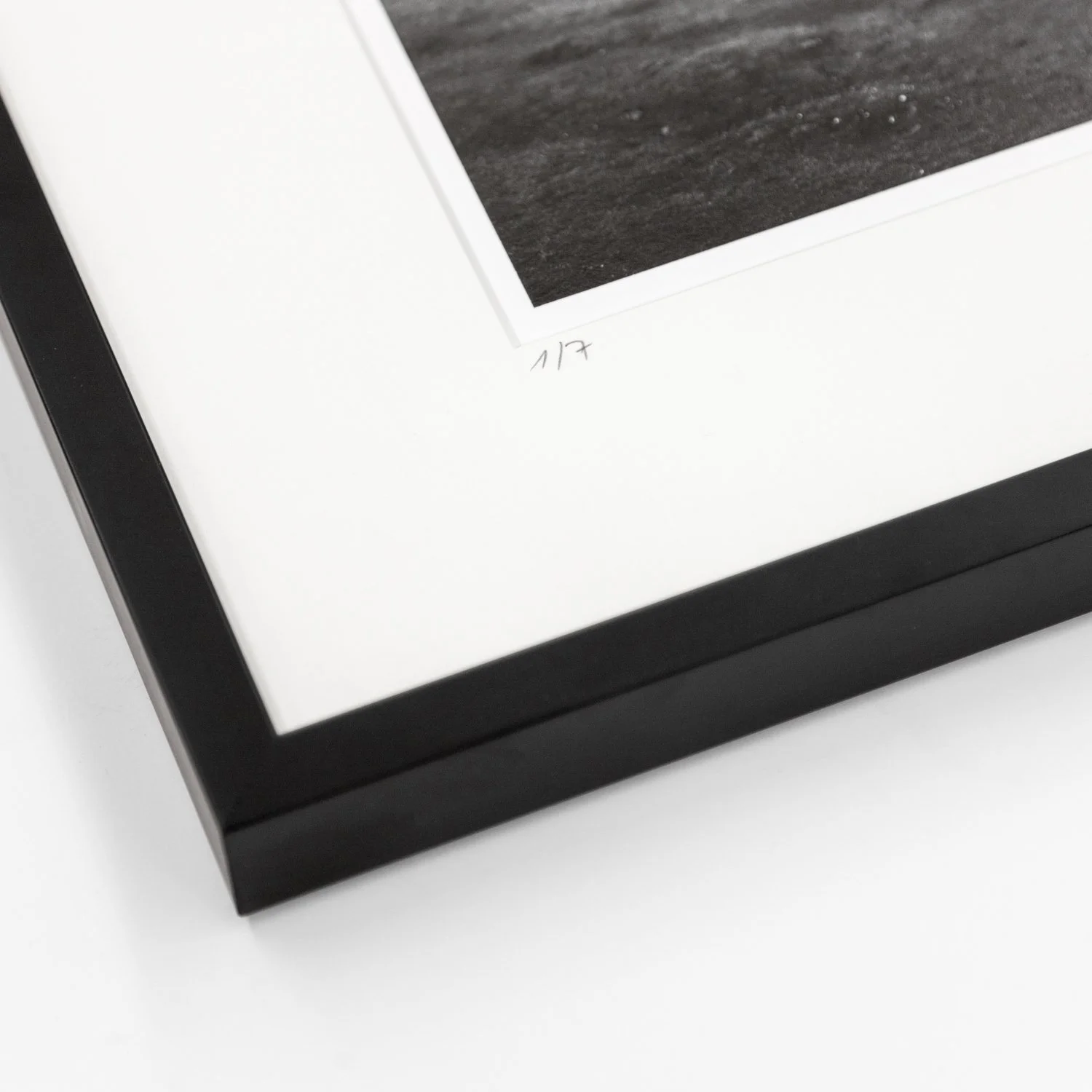 Detail of the black wooden frame and handwritten 2022 marking on Ancient Laurisilva Forest Study 10 by Gerald Berghammer.