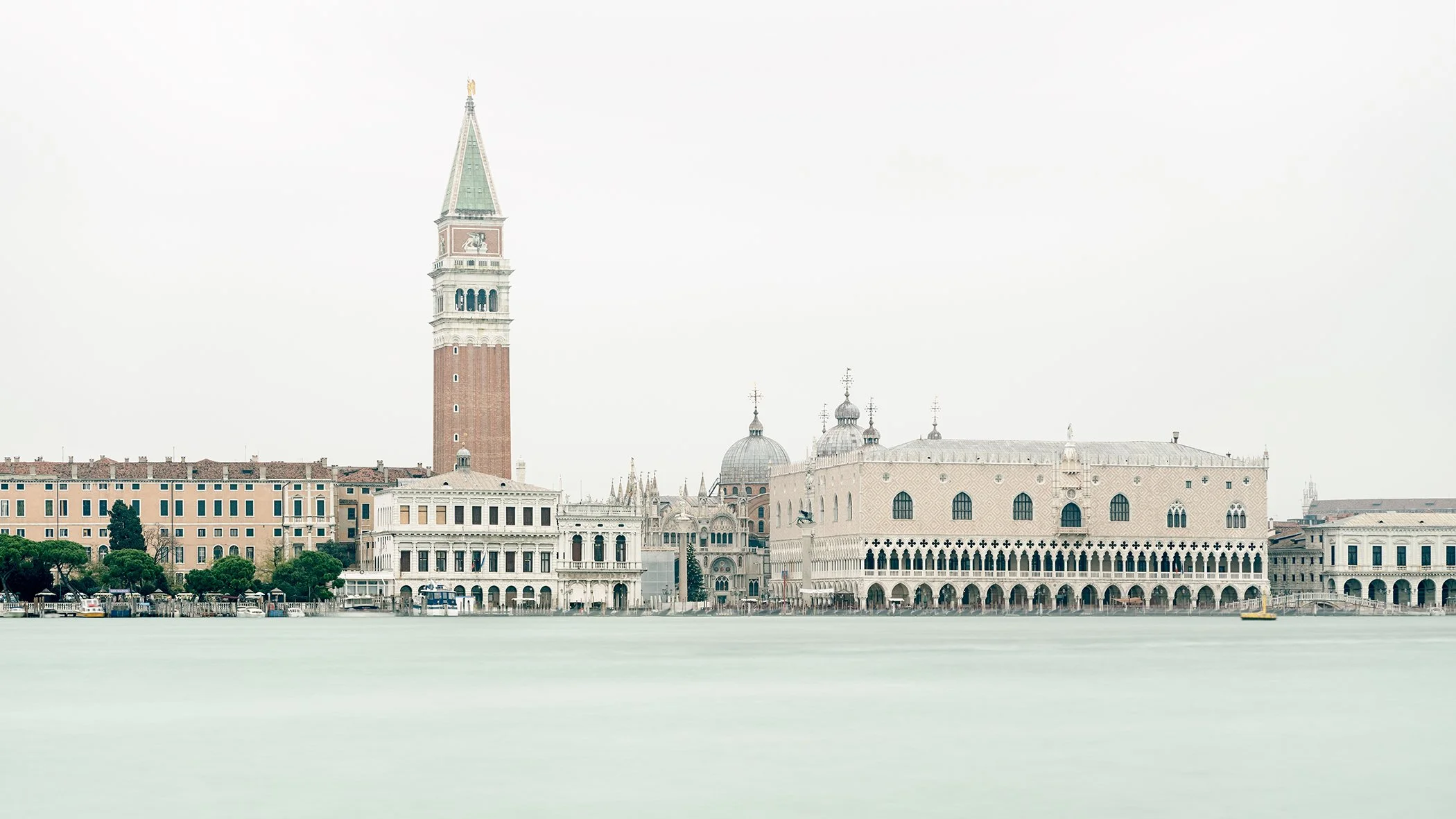Venice skyline with St Mark’s Campanile and the Doge’s Palace rising above softly blurred lagoon waters. Photo by Gerald Berghammer.