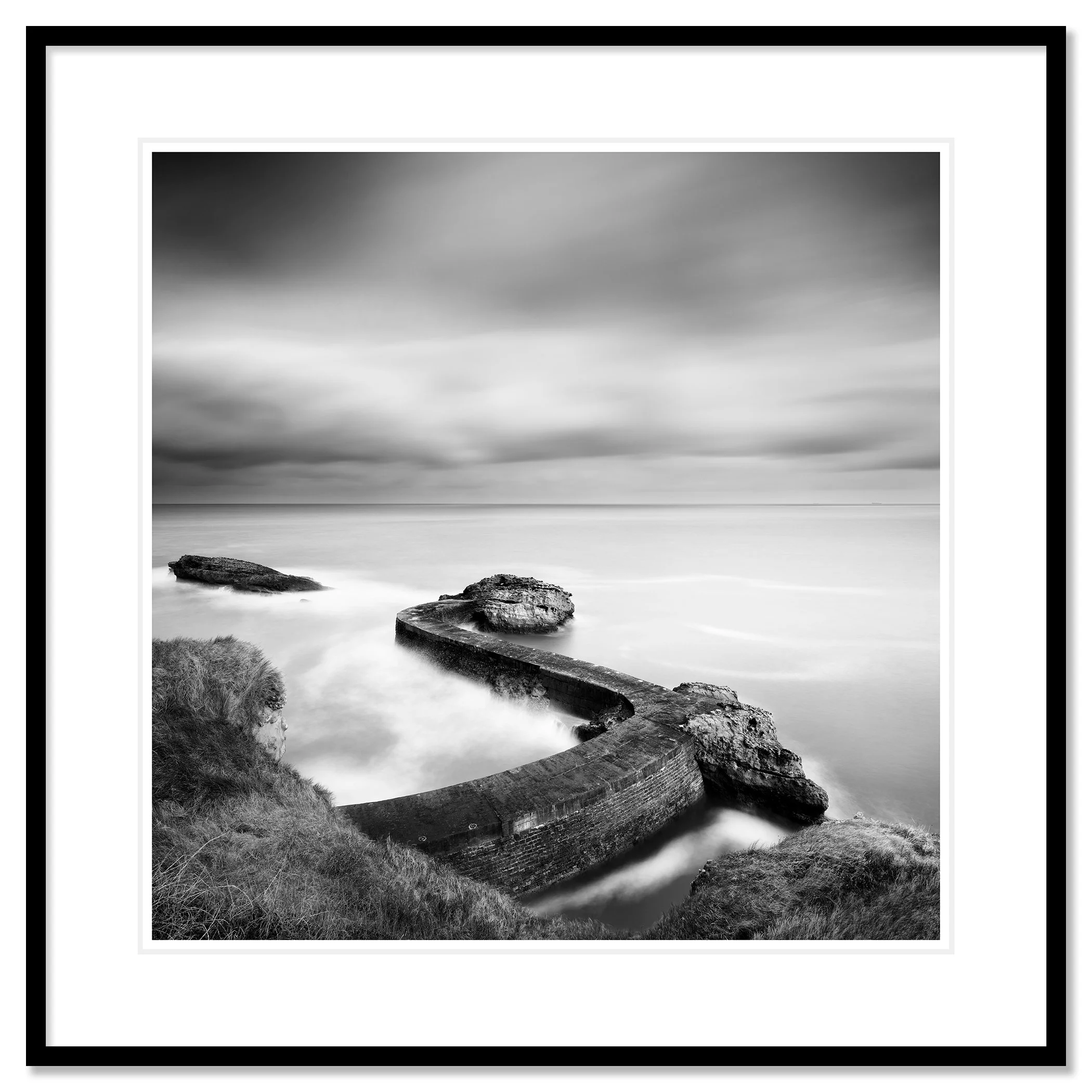 Breakwater Pier Study 1 by Gerald Berghammer, black-and-white fine art print in a black aluminium frame with white mount.