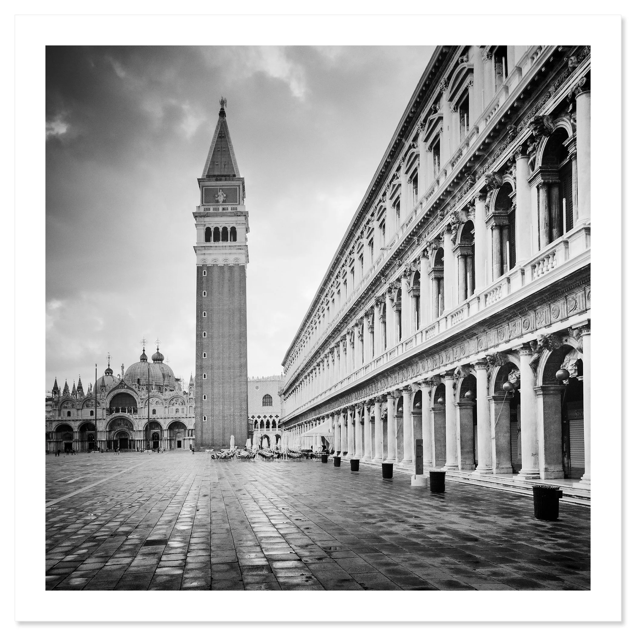 Gerald Berghammer - B&W Cityscape Photography. St. Mark's Square in Venice, showing the Campanile bell tower, St. Mark's Basilica and historic buildings. Fine art print only