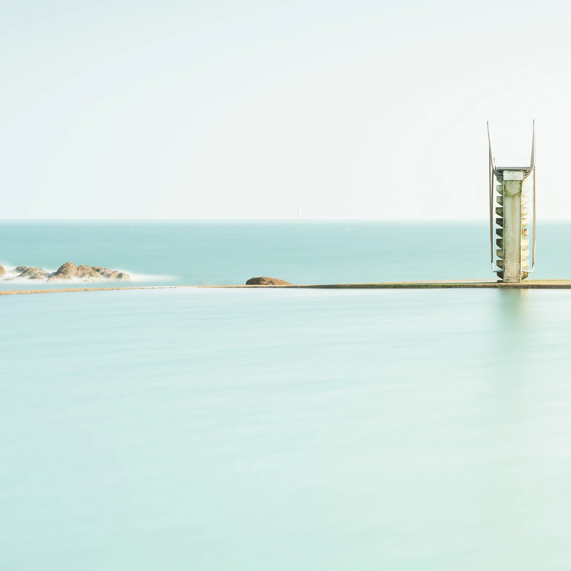 Detail of Diving Platform Panorama Study 2 by Gerald Berghammer, showing the diving platform, calm turquoise water and coastal rocks.