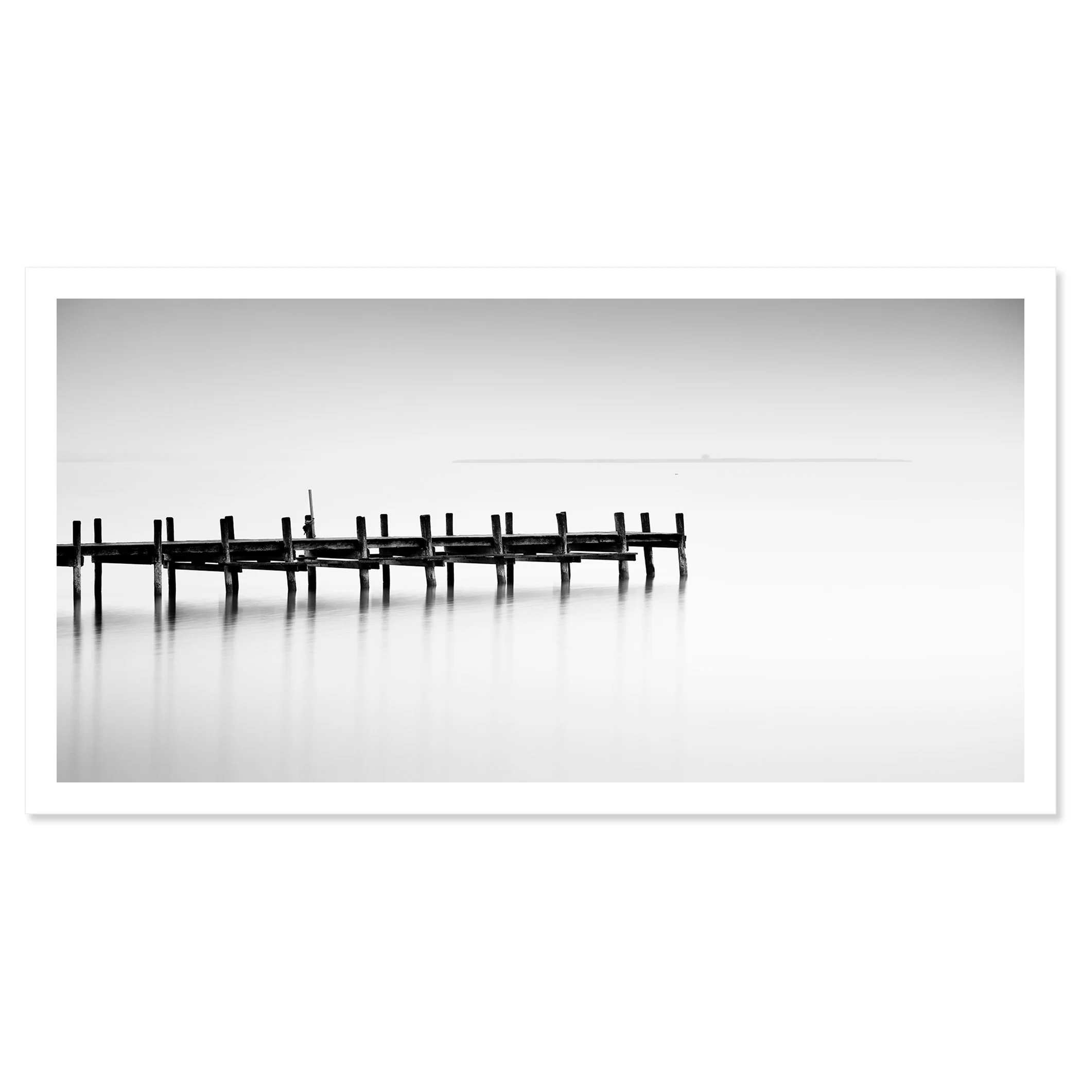© 2023 Gerald Berghammer - Black and white long exposure waterscape photo. Wooden pier extending into calm water, with a minimalistic and serene background. Fine art print only