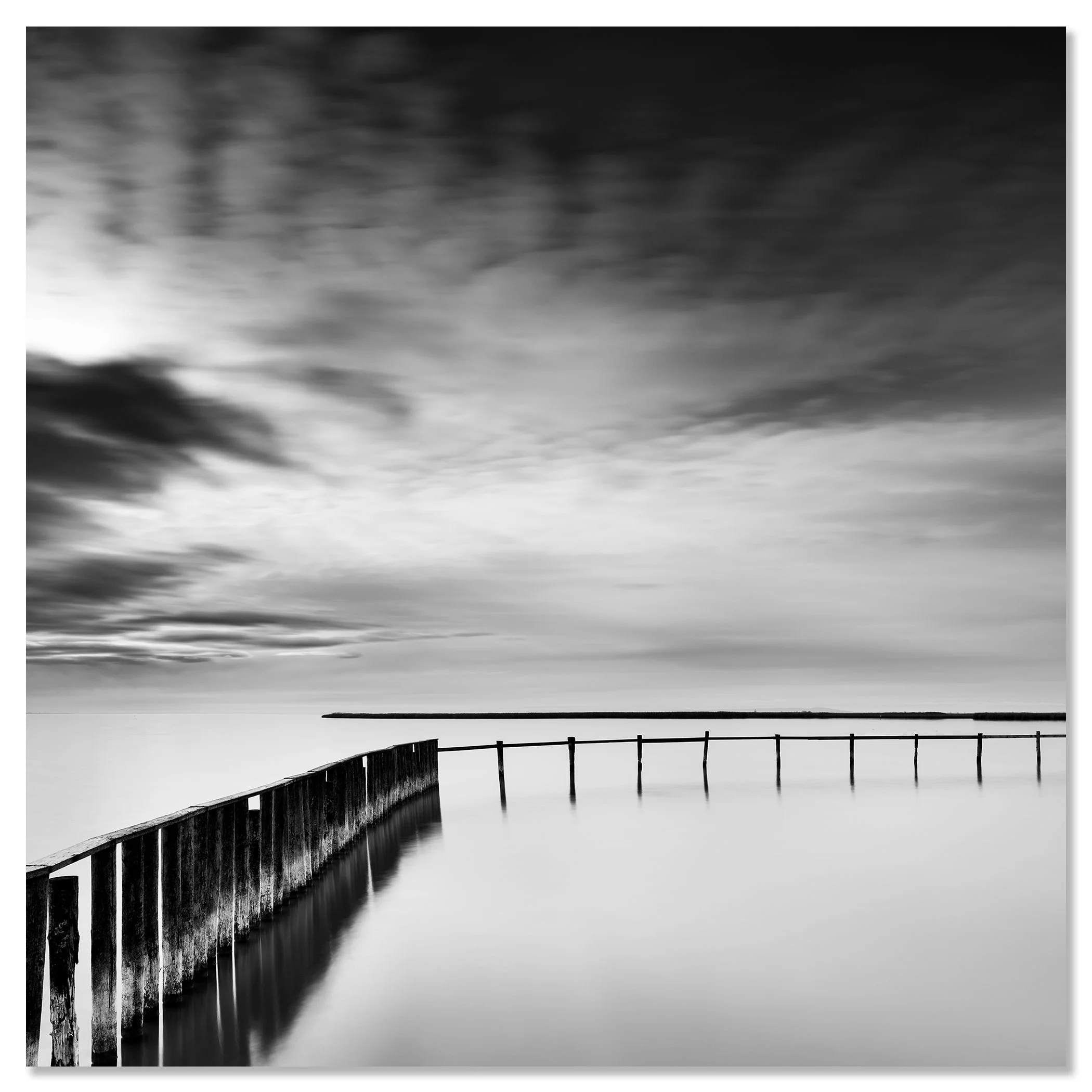 Minimalist black and white landscape with still water and a long wooden jetty – dibond frameless