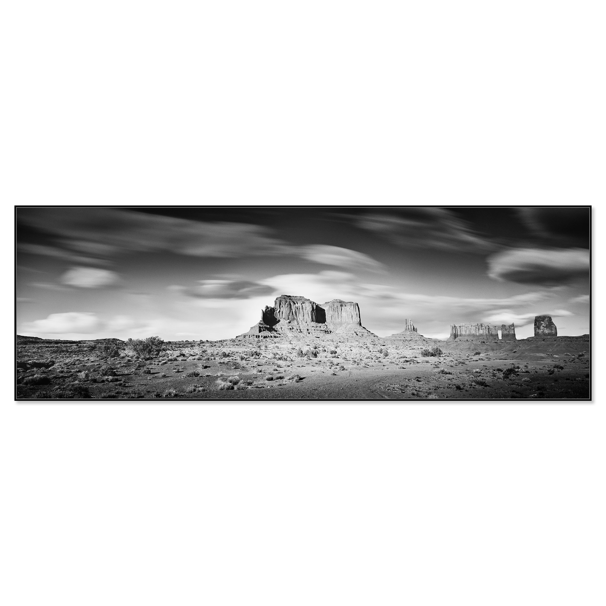 © 2015 Gerald Berghammer - Black and white photography. Landscape of rugged desert terrain with large rock formations and scattered vegetation under a cloudy sky. Chromaluxe framed black