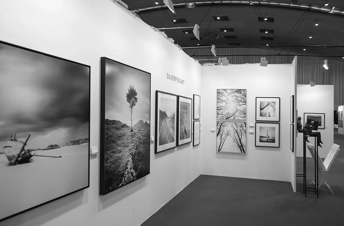 SILVERFINEART exhibition stand with framed black-and-white photographs by Gerald Berghammer at art KARLSRUHE 2018.