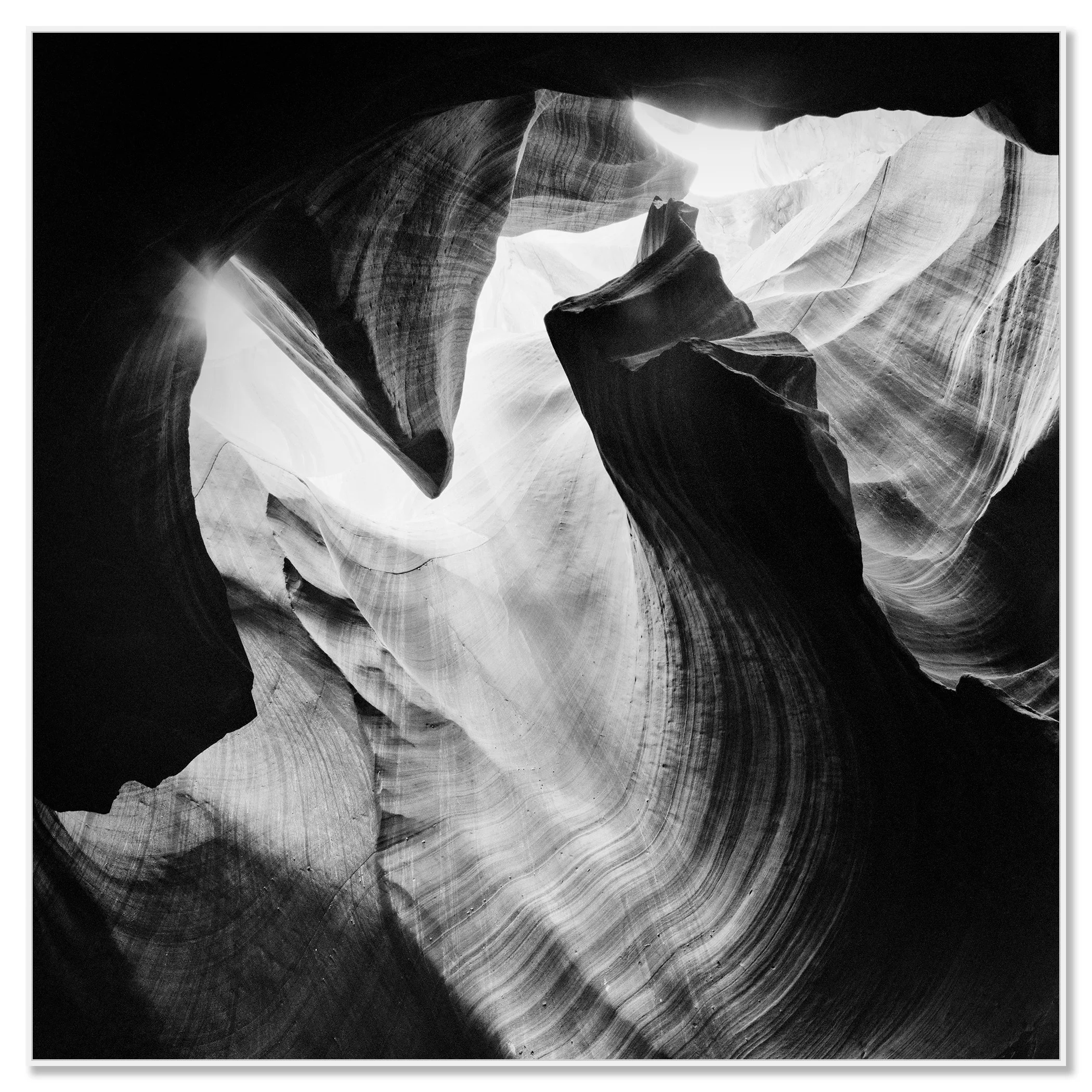 Antelope Canyon Study 4 displayed as a black-and-white Dibond print in a white aluminium ArtBox frame by Gerald Berghammer.