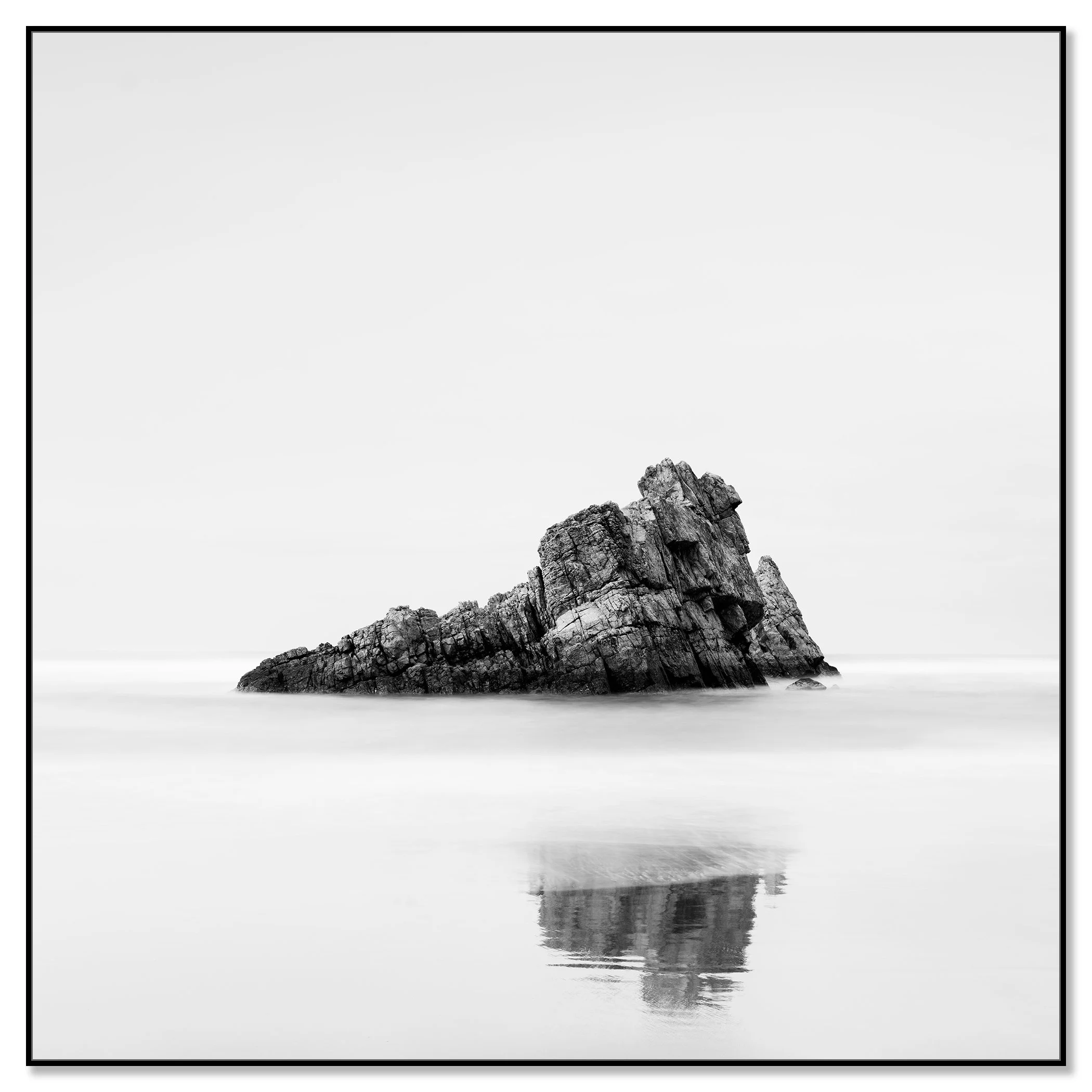 Rock on the Beach, Study 1 – black-and-white photograph mounted on aluminium Dibond in a black ArtBox frame by Gerald Berghammer.
