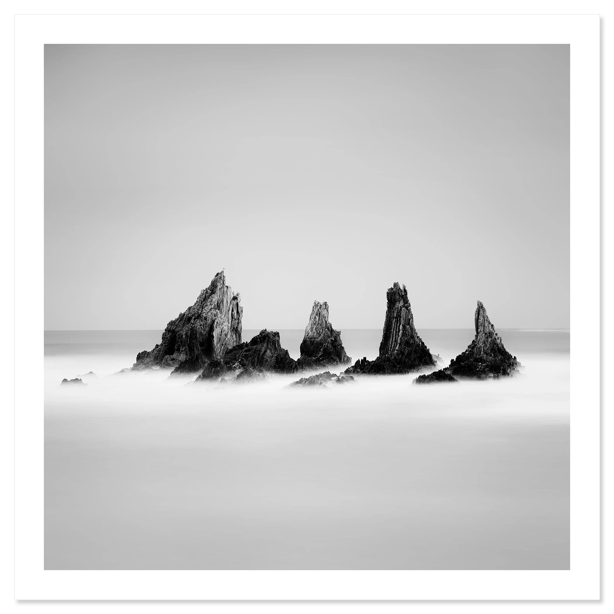 Rocky Peaks Study 1 by Gerald Berghammer, black-and-white fine art seascape of sea stacks in Spain, shown as an archival pigment print.
