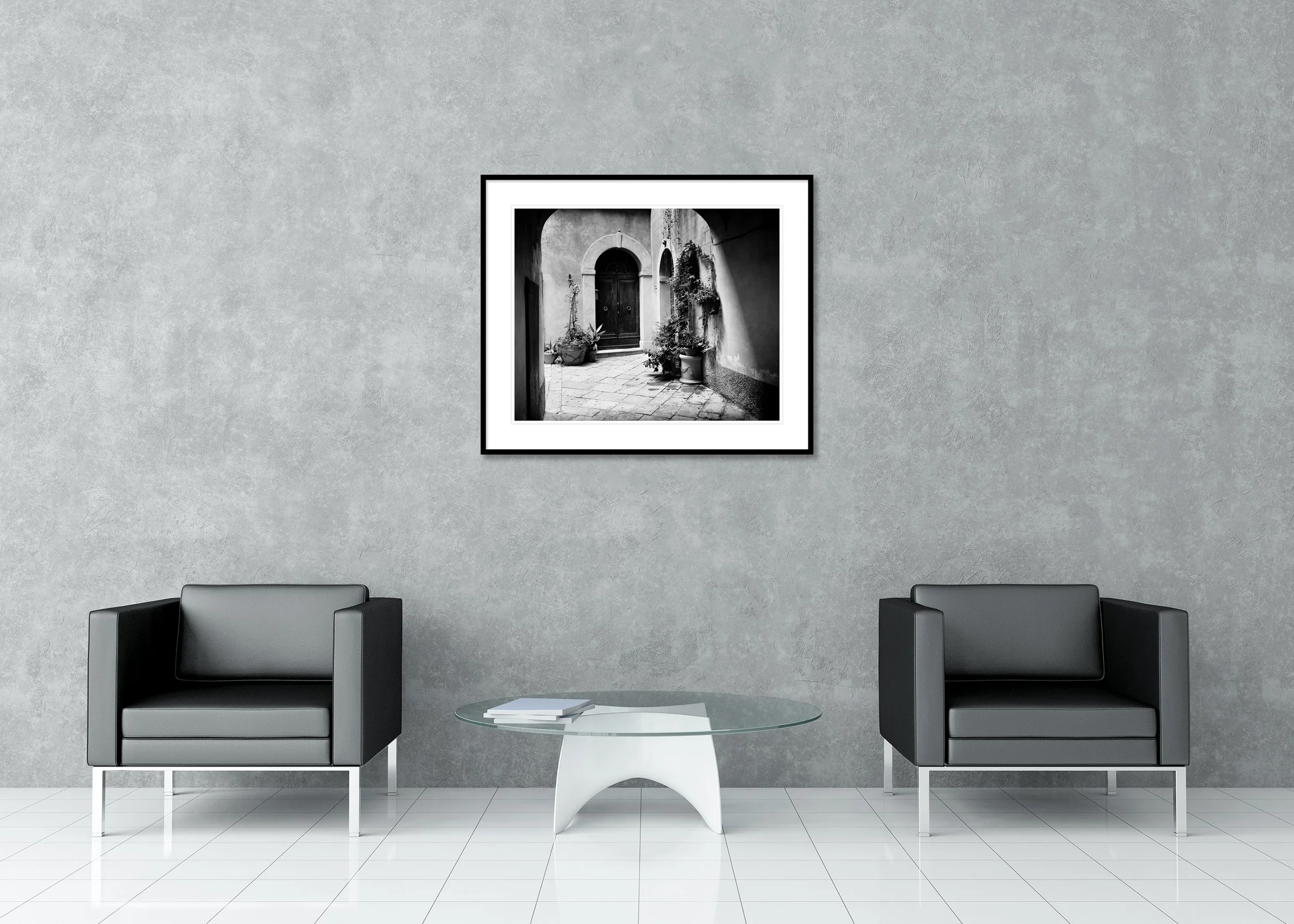 Tuscan Courtyard Study 2 displayed in a modern interior as an archival pigment print in a black aluminium frame with white mount by Gerald Berghammer.