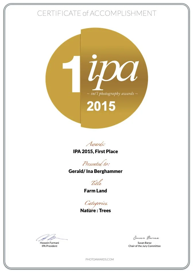 nternational Photography Awards 2015 First Place certificate for FARM LAND by Gerald Berghammer and Ina Forstinger, displayed alongside the gold IPA emblem.