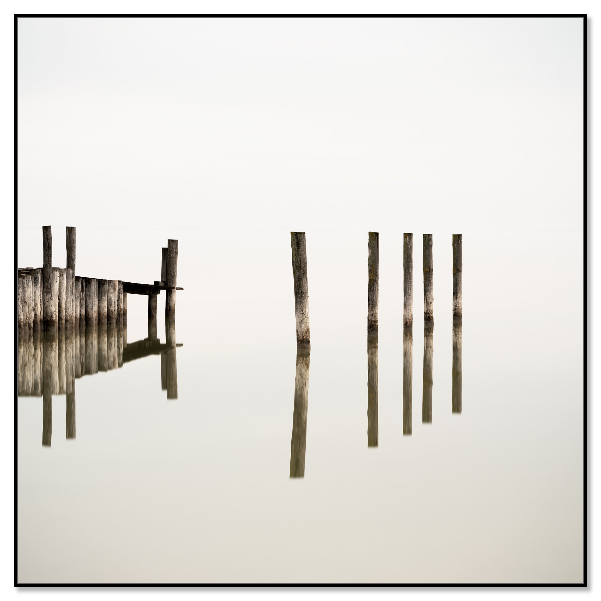 Wooden Pegs in the Lake – colour photograph on aluminium Dibond in a black aluminium ArtBox.