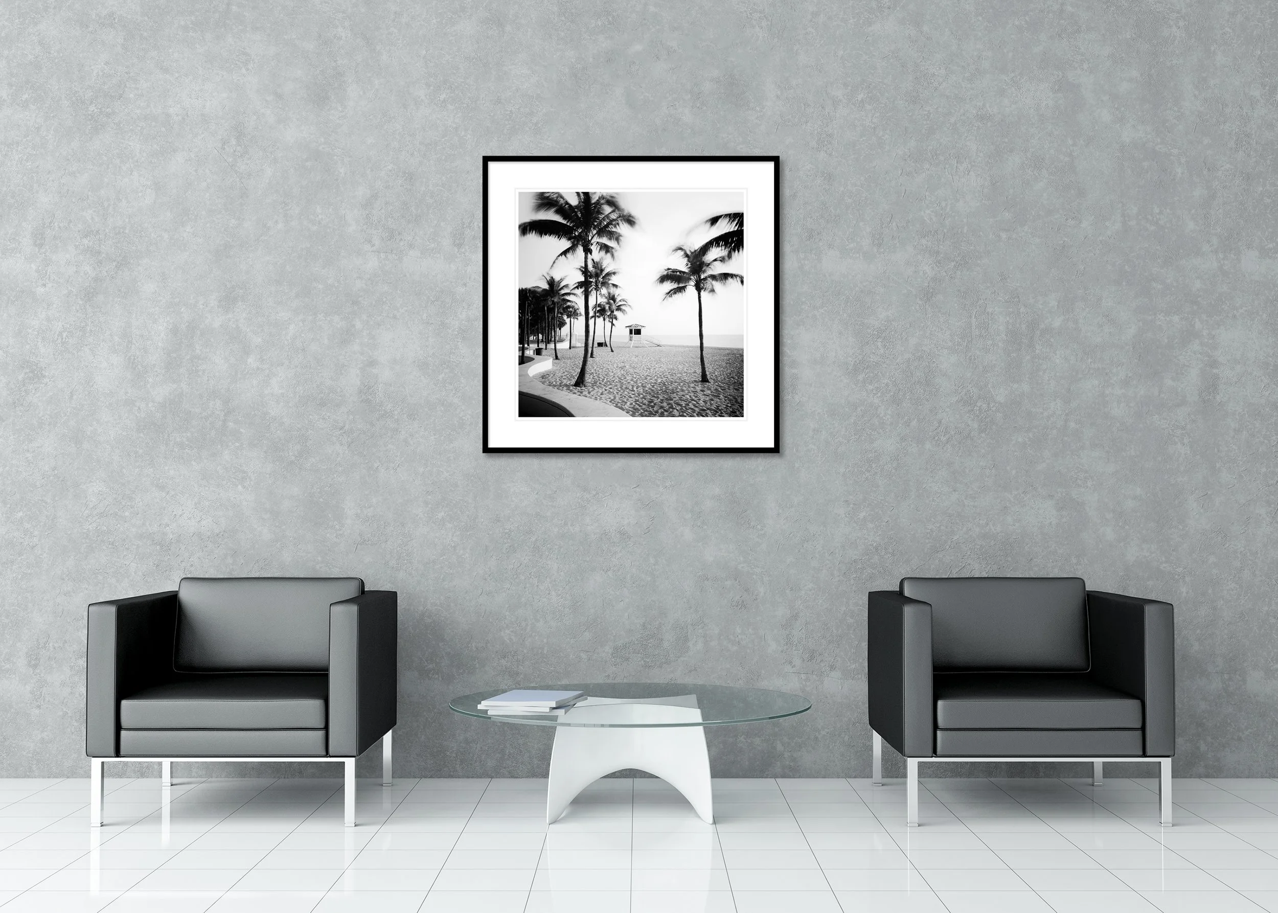 Black-and-white Florida beach photo with palm trees, sandy shoreline and a lifeguard tower by the ocean, archival pigment print in a classic frame with a mount.