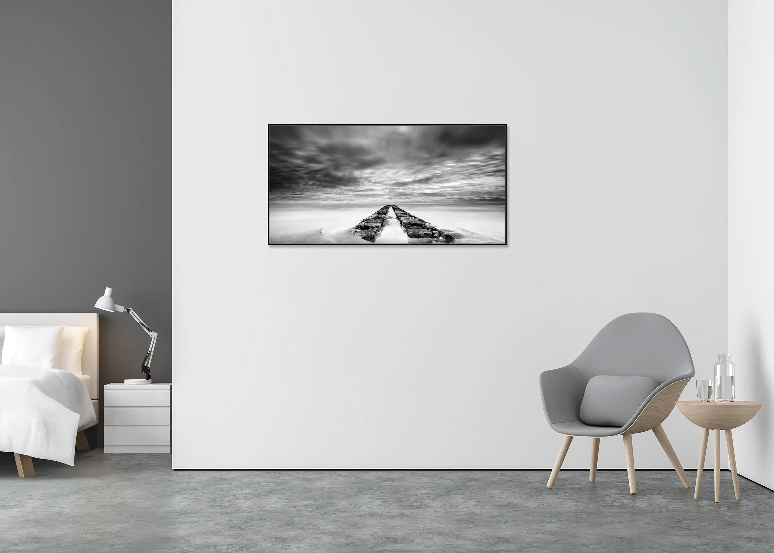 Rock Pier, Panorama Study 1 by Gerald Berghammer, black-and-white Dibond print in a black aluminium ArtBox frame displayed in a minimalist interior.