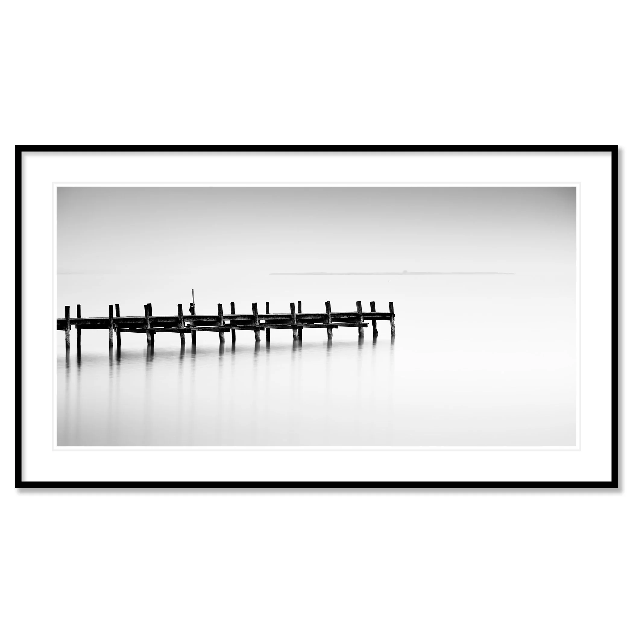 © 2023 Gerald Berghammer - Black and white long exposure waterscape photo. Wooden pier extending into calm water, with a minimalistic and serene background. Classic framed black