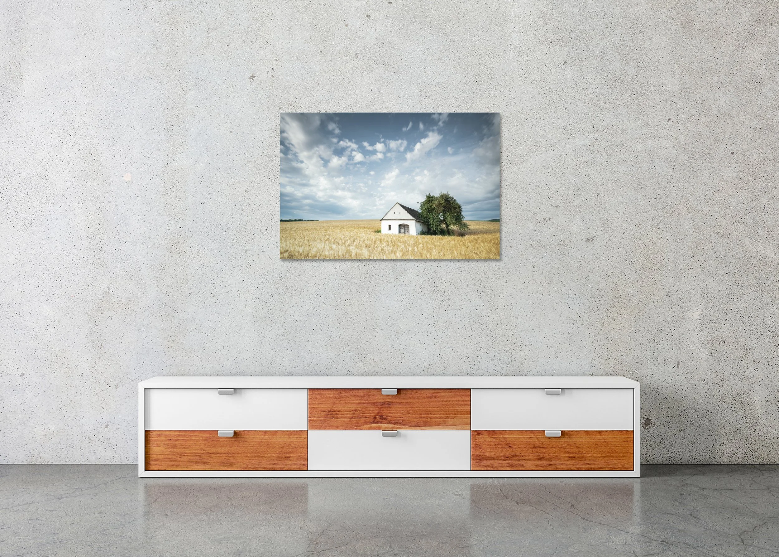 Wine Press House in the Wheat Field displayed in a modern interior as a frameless colour artwork mounted on aluminium Dibond by Gerald Berghammer.