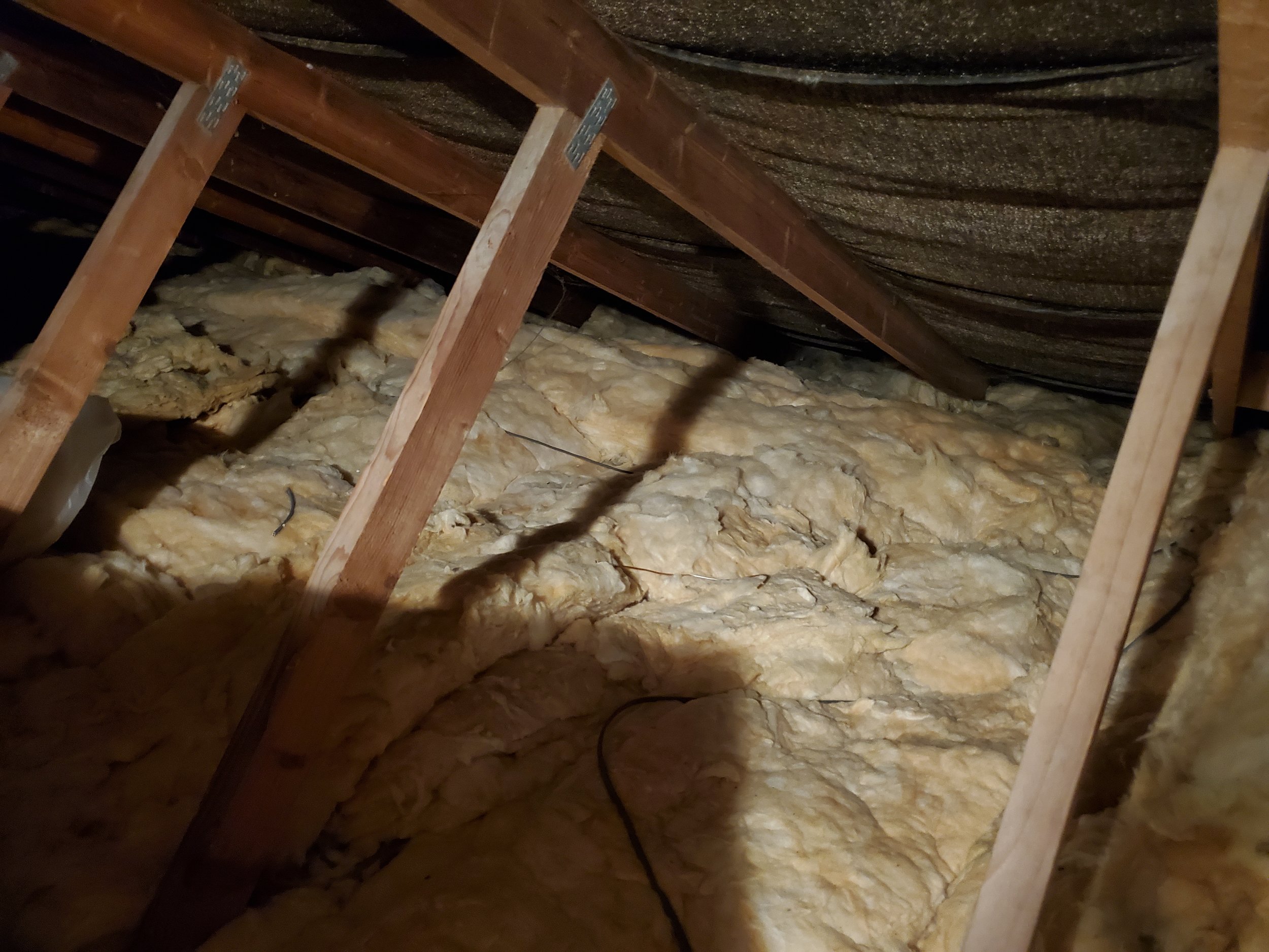Attic insulation between and over joists
