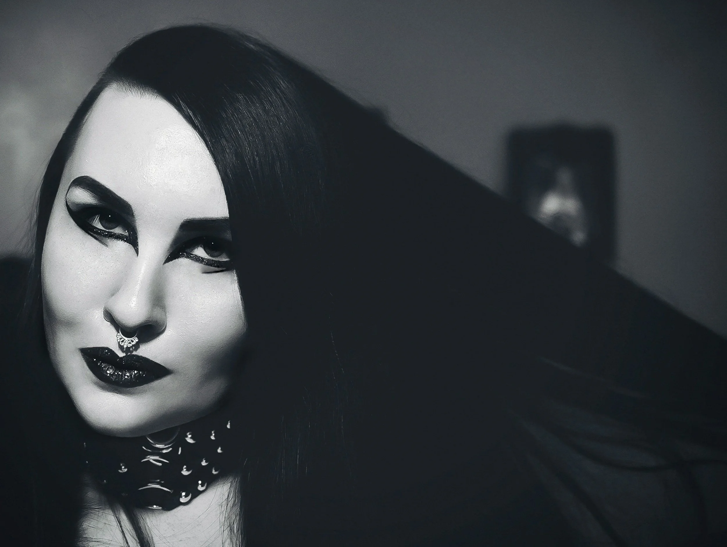 Goth woman with black makeup and dark hair at Whitby Goth Weekend festival