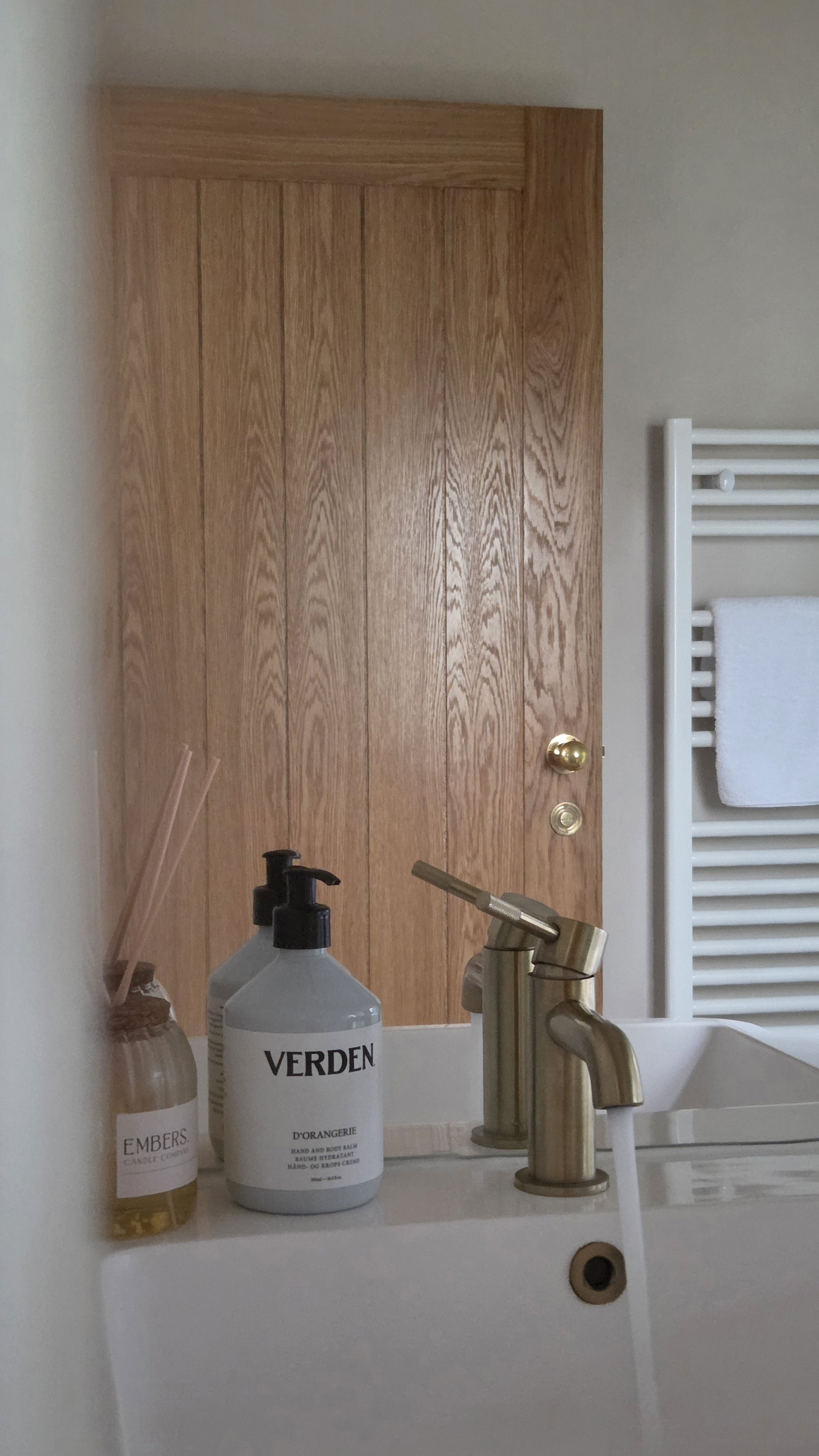 Boutique bathroom with brushed brass fittings and luxury toiletries at The Lodge Burniston.