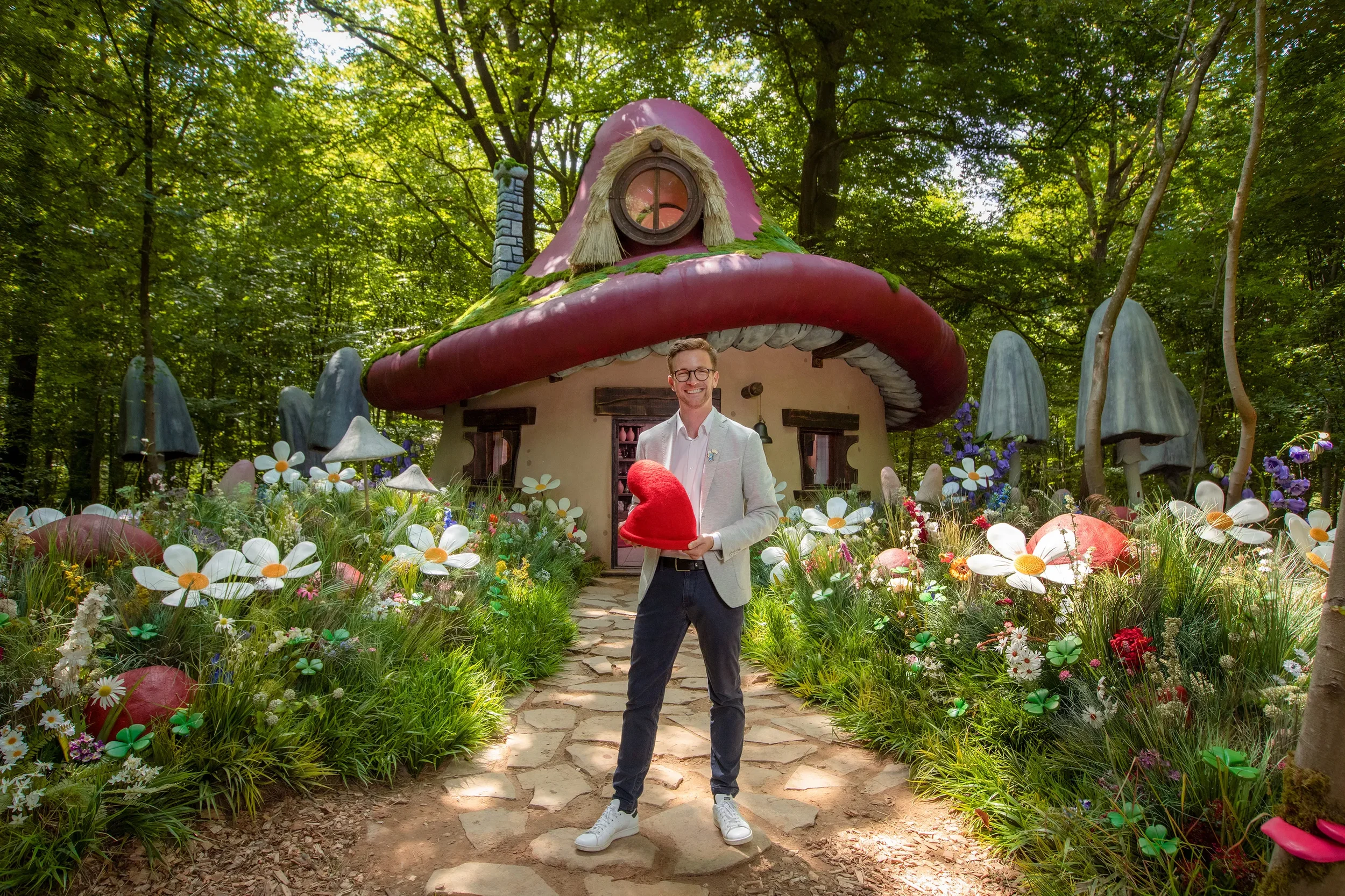 Nicolas Tytgat, grandson of Smurfs creator Peyo, welcomes guests at the Airbnb Smurfs Experience in Belgium