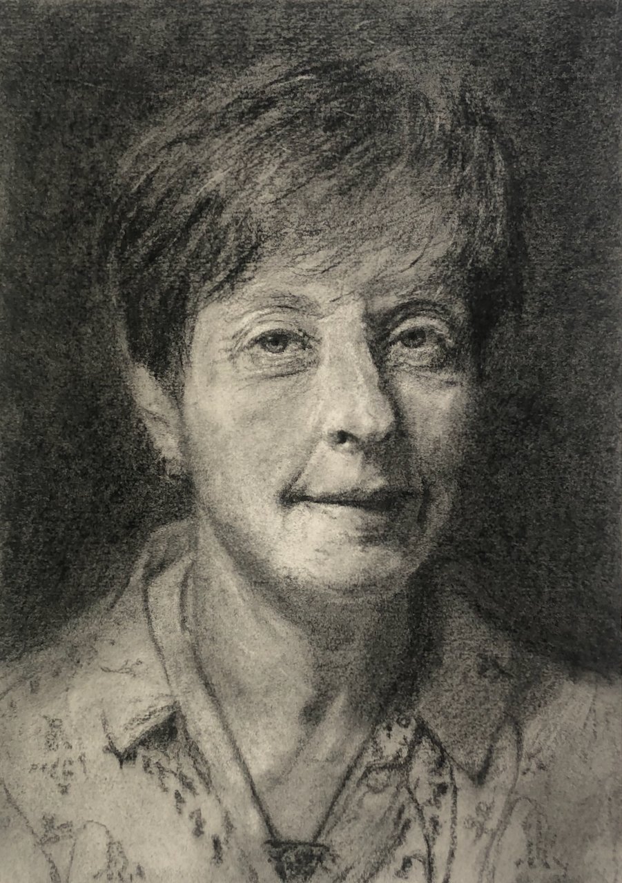 A detailed black and white portrait of an older woman with short hair, wearing a patterned blouse and necklace.