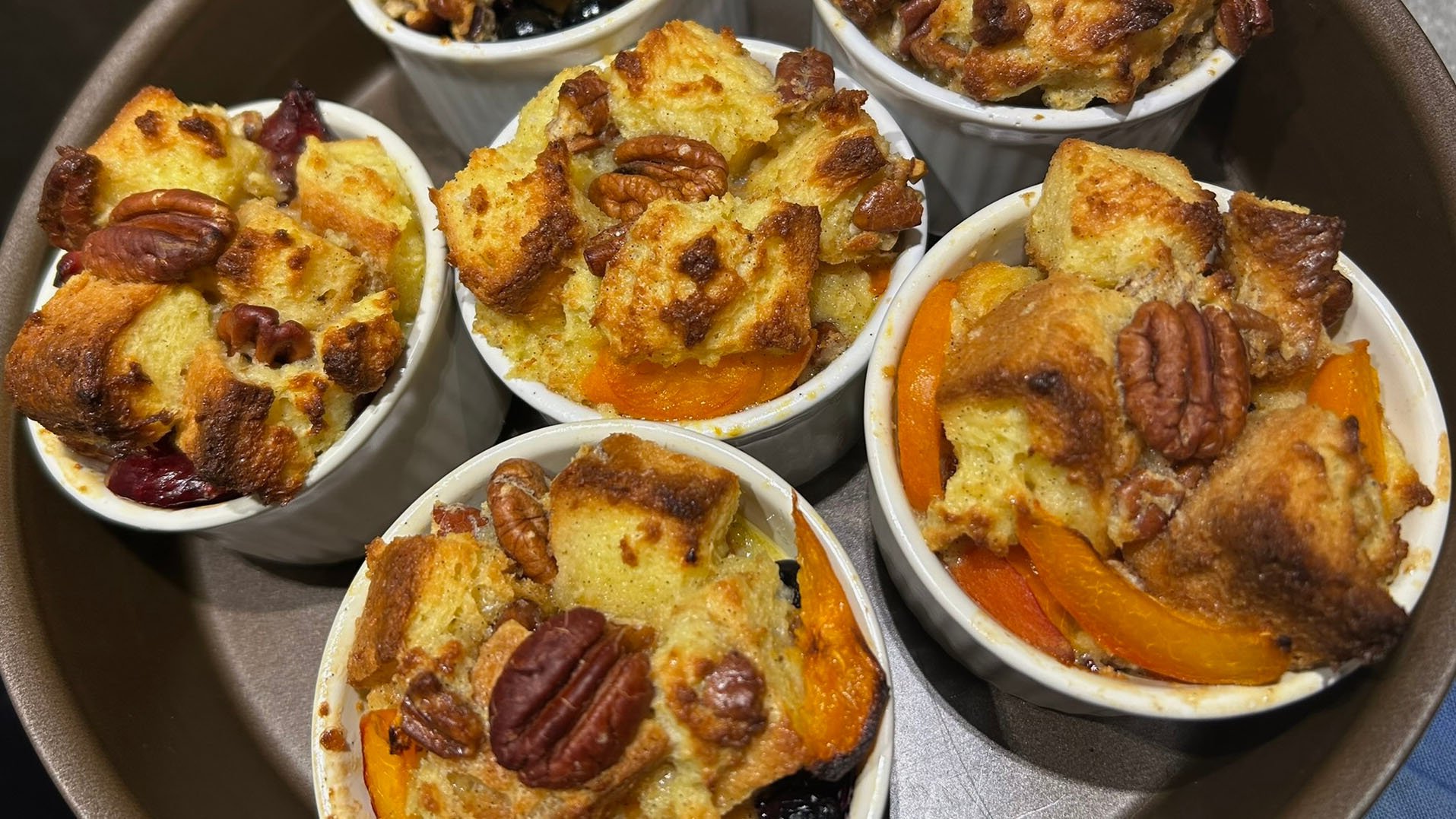 Pecan bread pudding served in individual ramekins for sharing