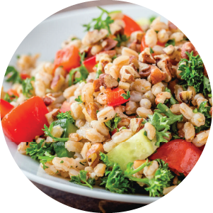 Bright, fresh salad made with pecan pieces, farro, tomatoes, and herbs