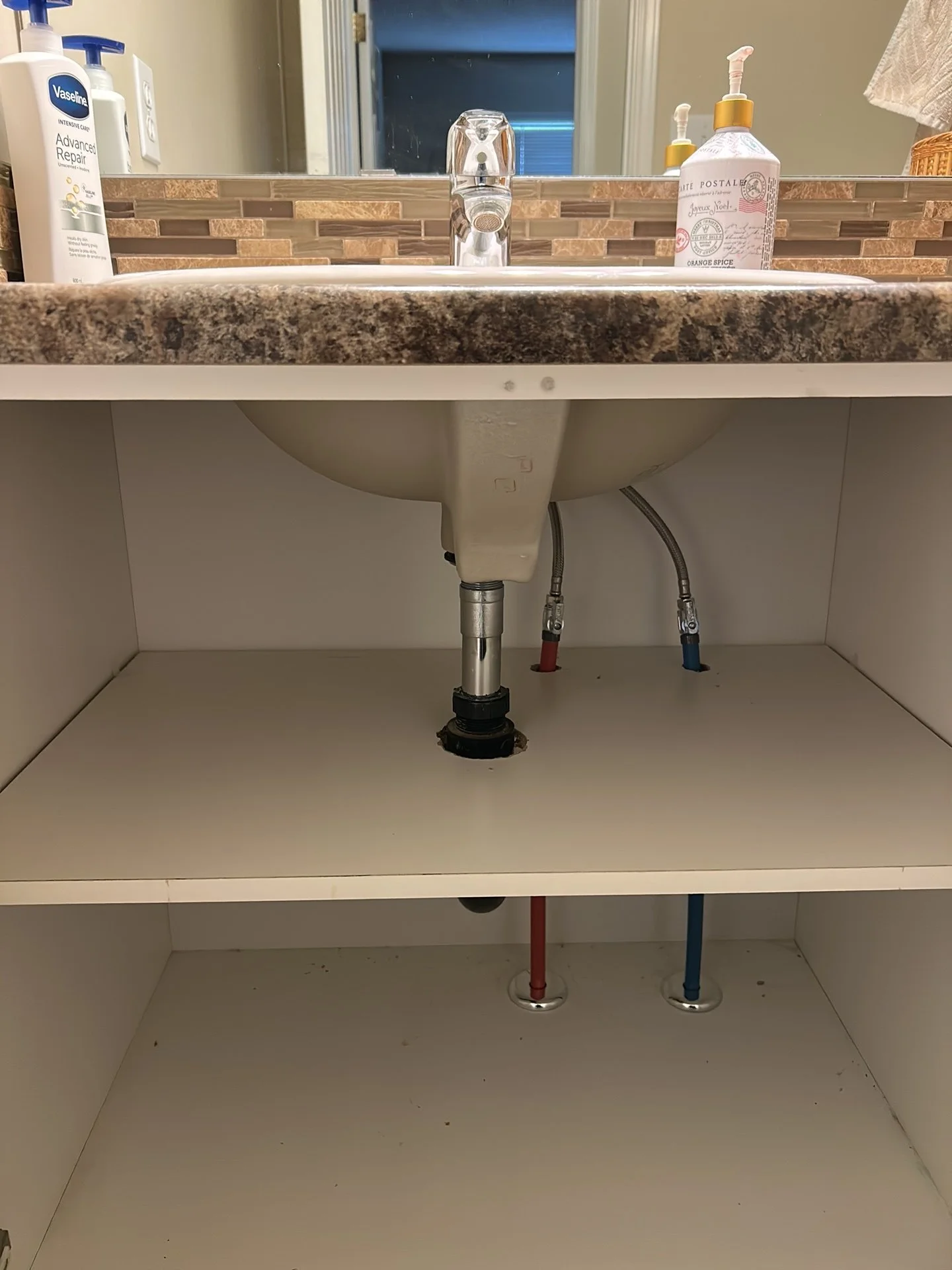 Updated bathroom waterlines with PEX-A piping during a residential Poly-B replacement in Edmonton