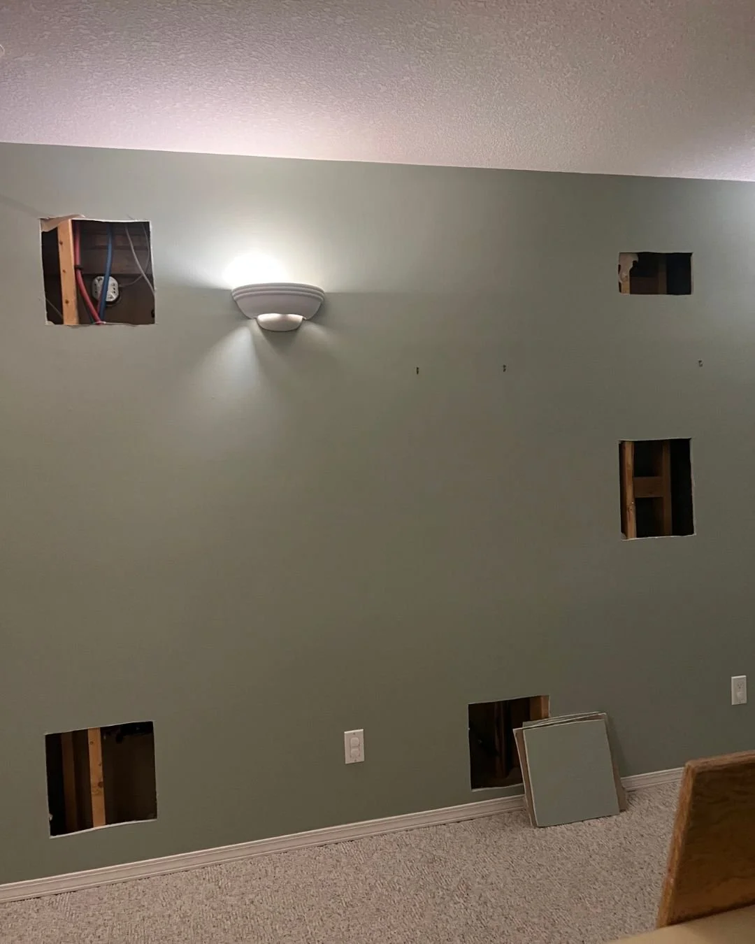 Drywall cut for Poly-B replacement by Studio Plumbing.jpg