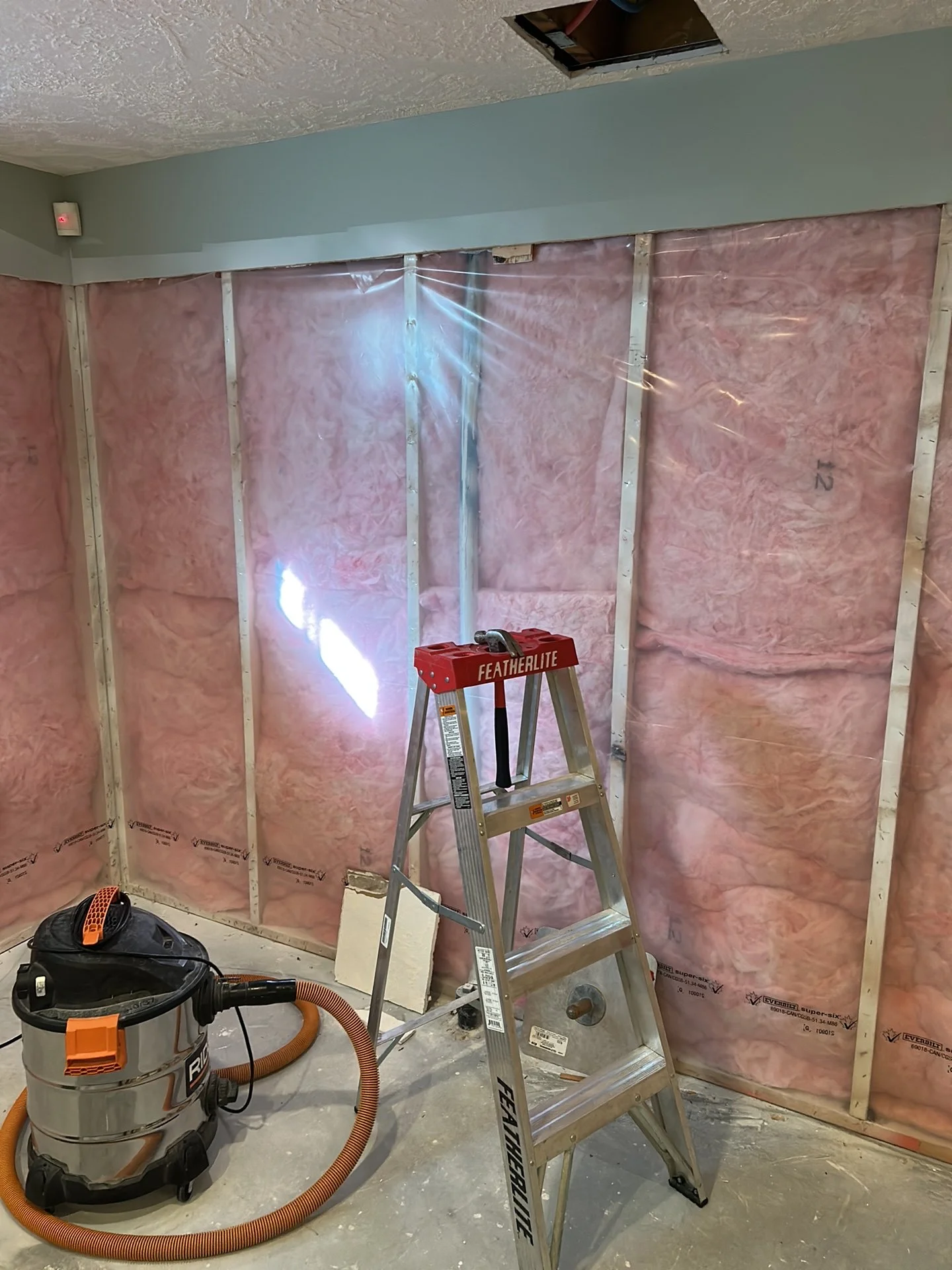 Existing Poly-B plumbing before replacement in a Falconer Heights home in Edmonton
