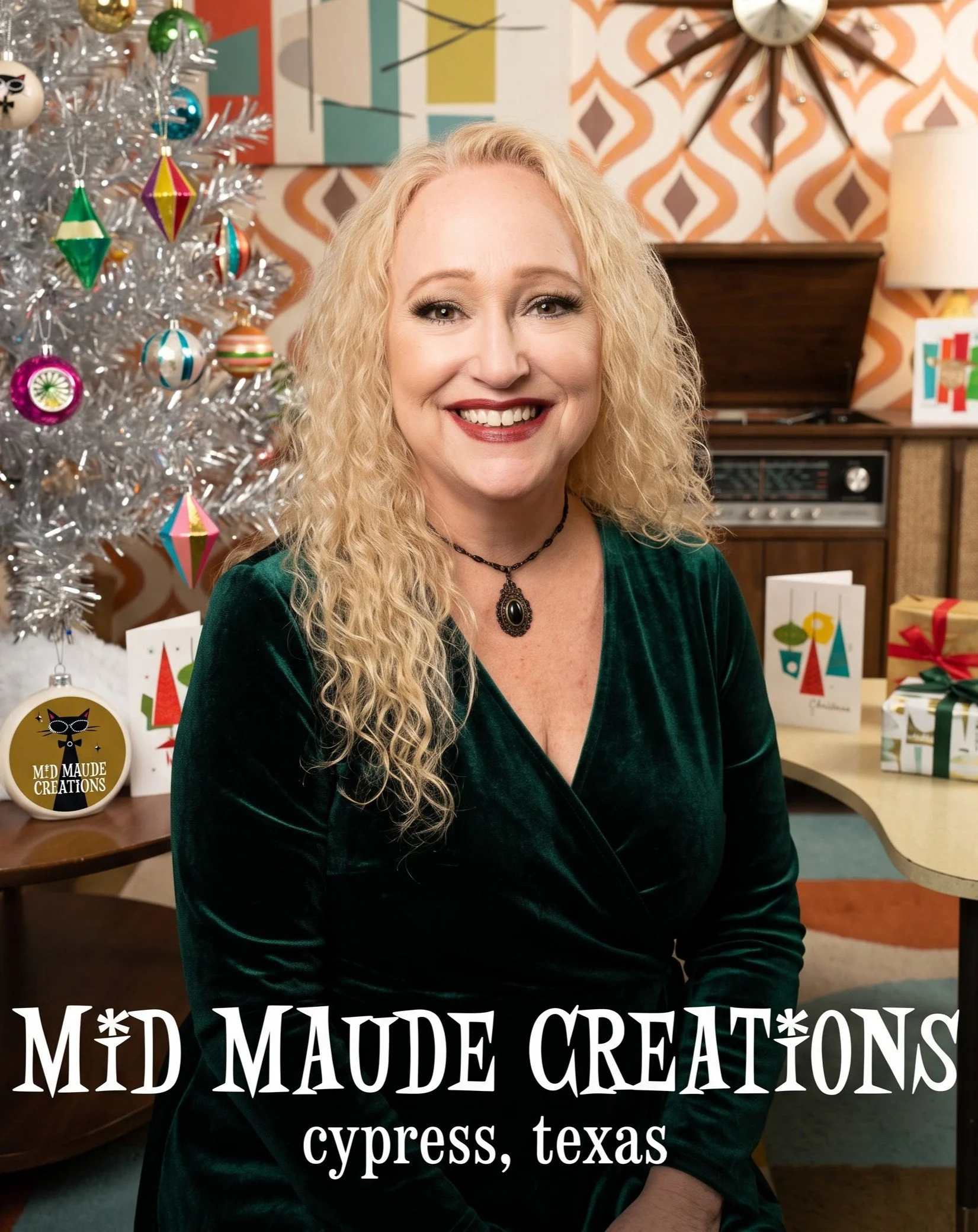 Portrait of a woman with curly blonde hair smiling, sitting in a festive setting with a decorated Christmas tree and holiday cards, with text overlay that reads 'Mid Maude Creations Cypress, Texas'.