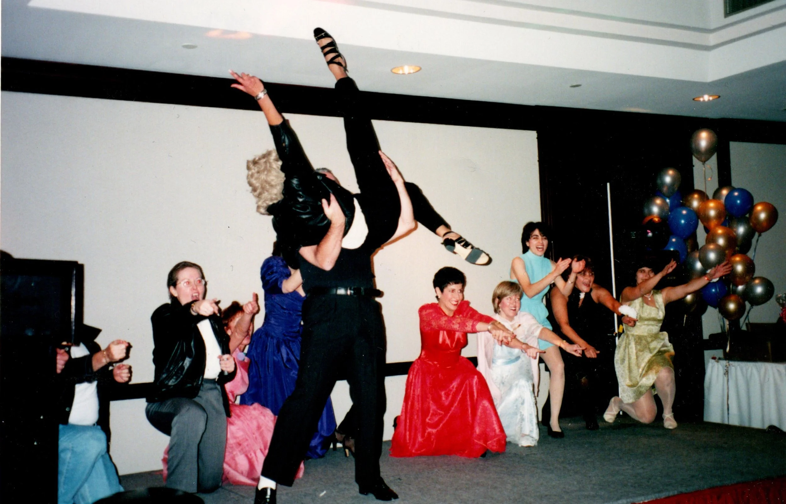 1997 - Management Team performing "you're the one that I want" from Grease for staff RBC. Yup, that's me in the air.