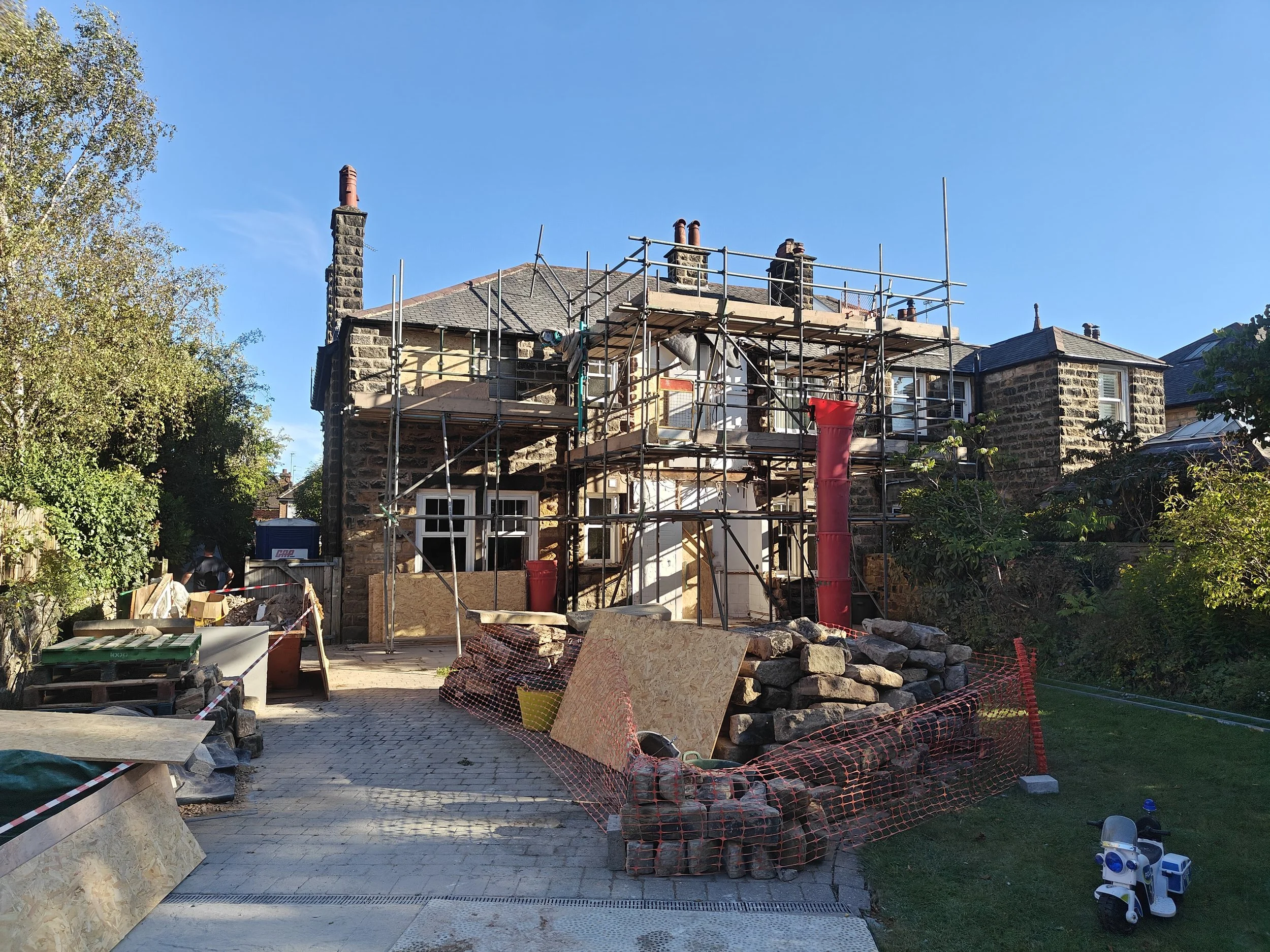 Belrow Hill project under construction with scaffolding, SIPs extension, Harrogate, North Yorkshire