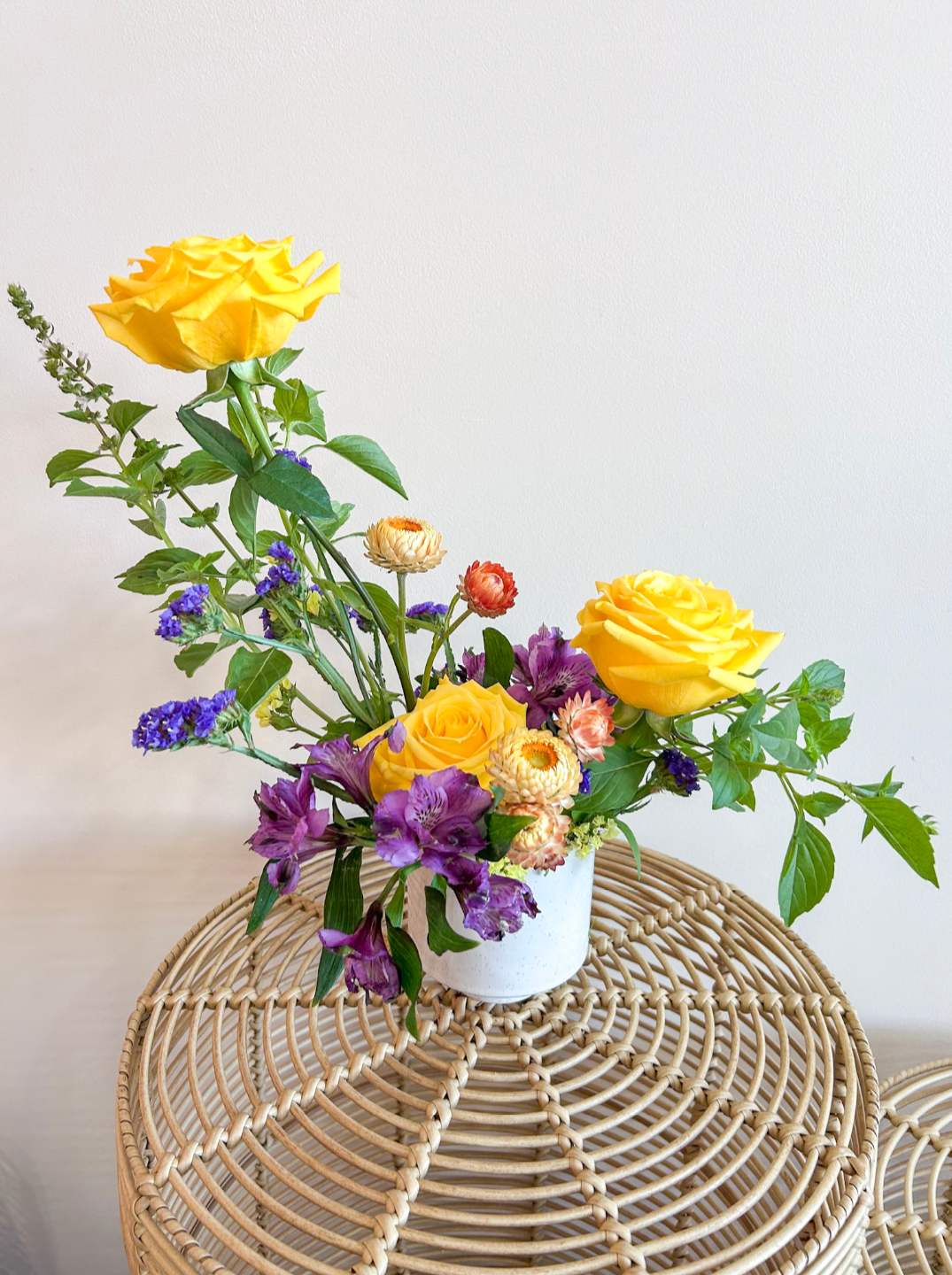 Arrangment with Yellow Roses and Purple flowers in white vase