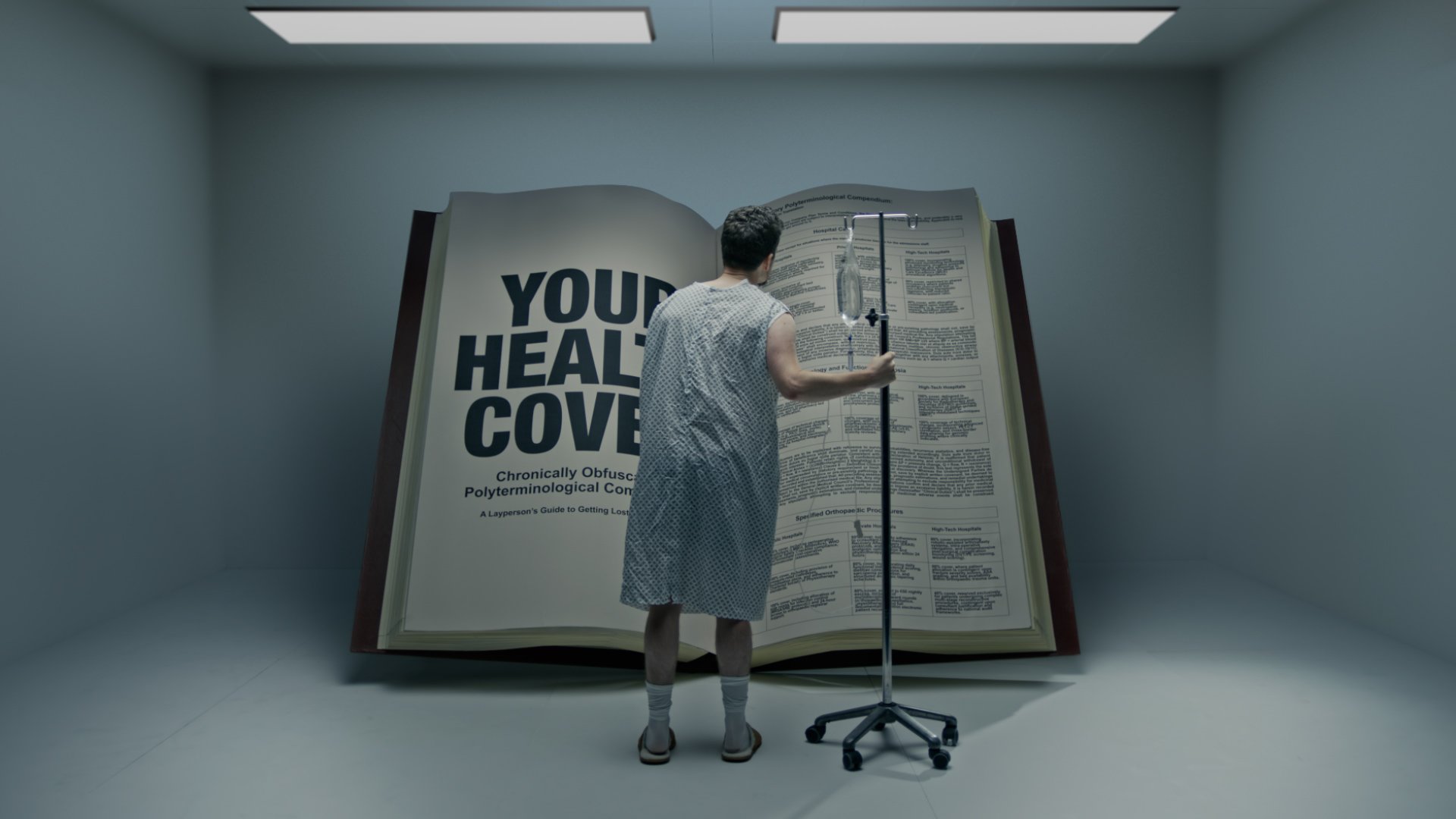 A person dressed in hospital gown standing with their back facing the camera, holding an IV pole, and in front of a large open book with medical articles and the text 'YOUR HEALTH COVERAGE' visible.