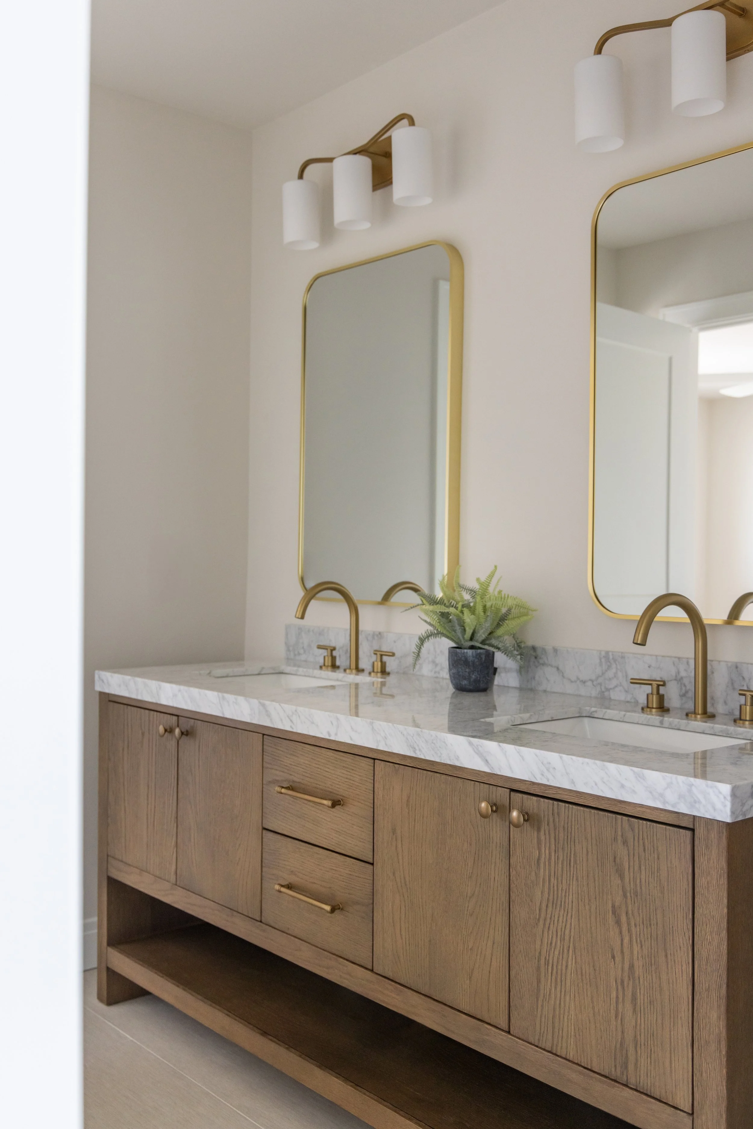 Bathroom vanity with dual sinks, mirrors and lights