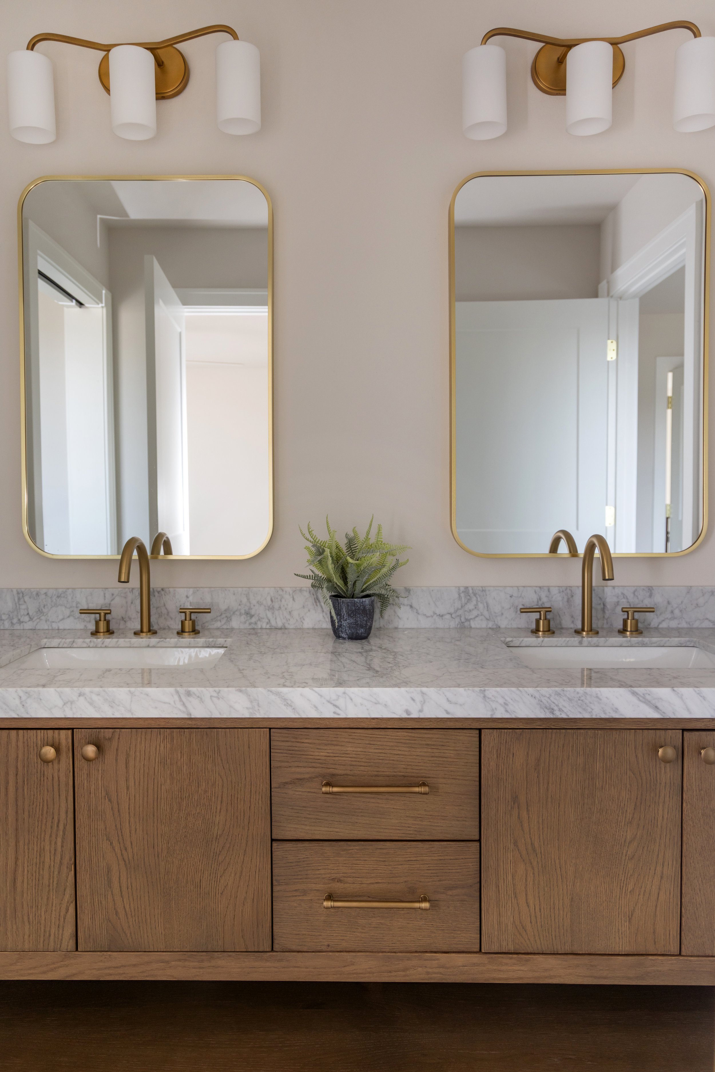 Double wooden vanity with dual mirrors and lights
